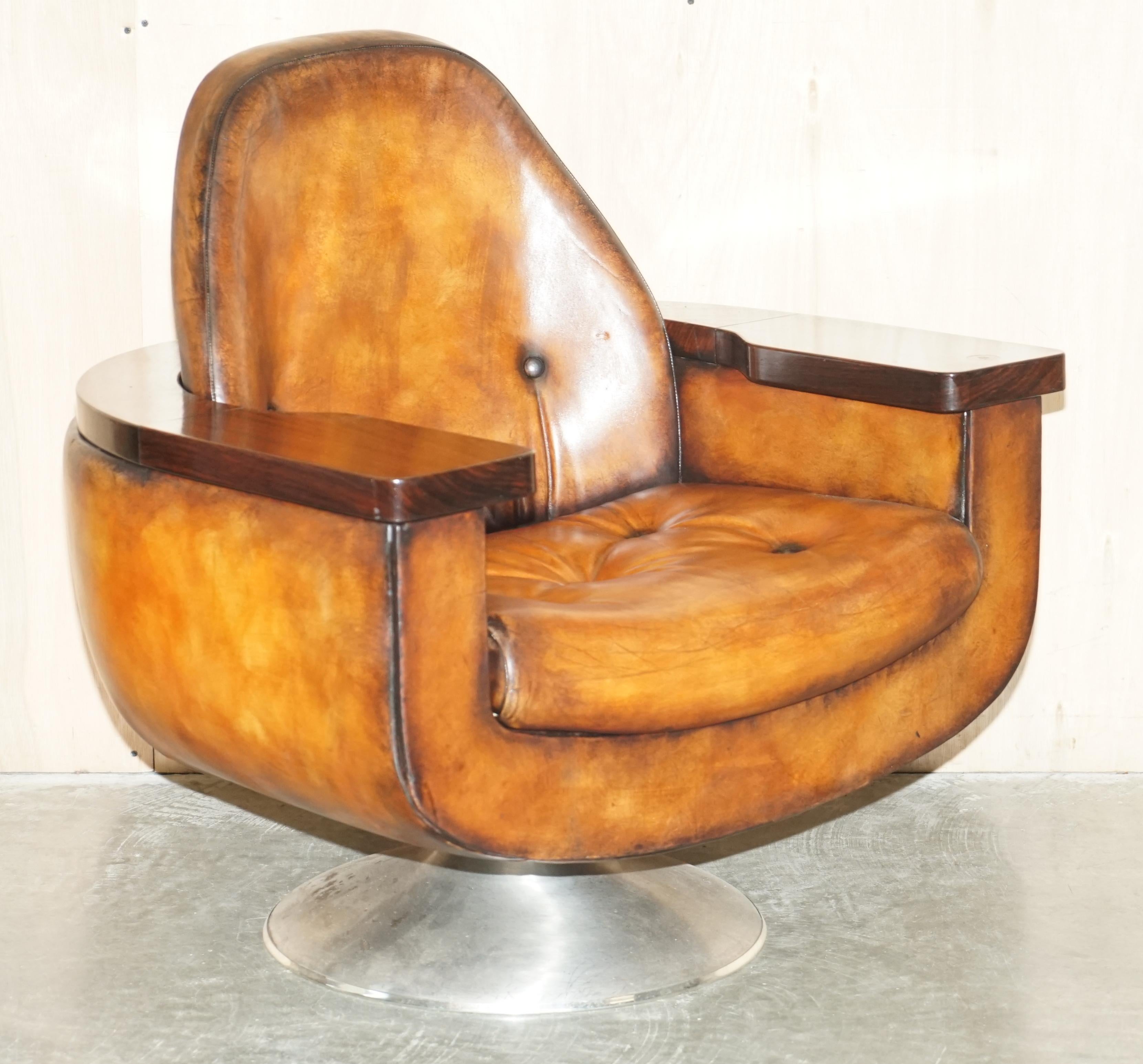 We are delighted to offer for sale this lovely pair of fully restored 1969, limited edition of 60, hand-dyed whiskey brown leather Peter Hoyte councilors armchairs with Rosewood frames that have internal storage


As things stand there are six in