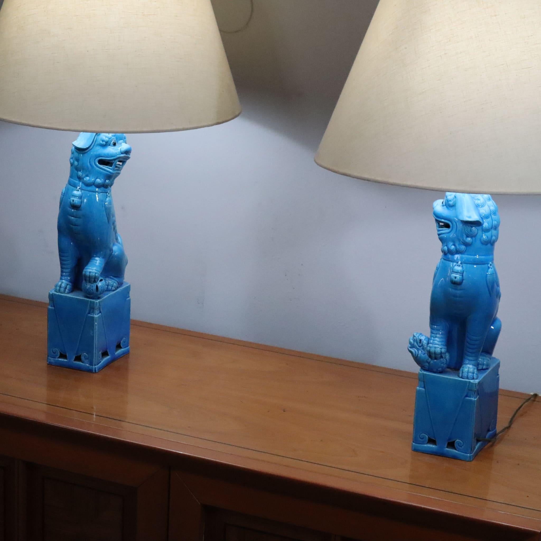 Pair of 1970s blue ceramic foo dog lamps vintage chinese
This elegant pair of 1950s ceramic Foo Dog lamps features a striking design inspired by the legendary Chinese guardian lions, symbolizing protection and good fortune. Crafted from vibrant