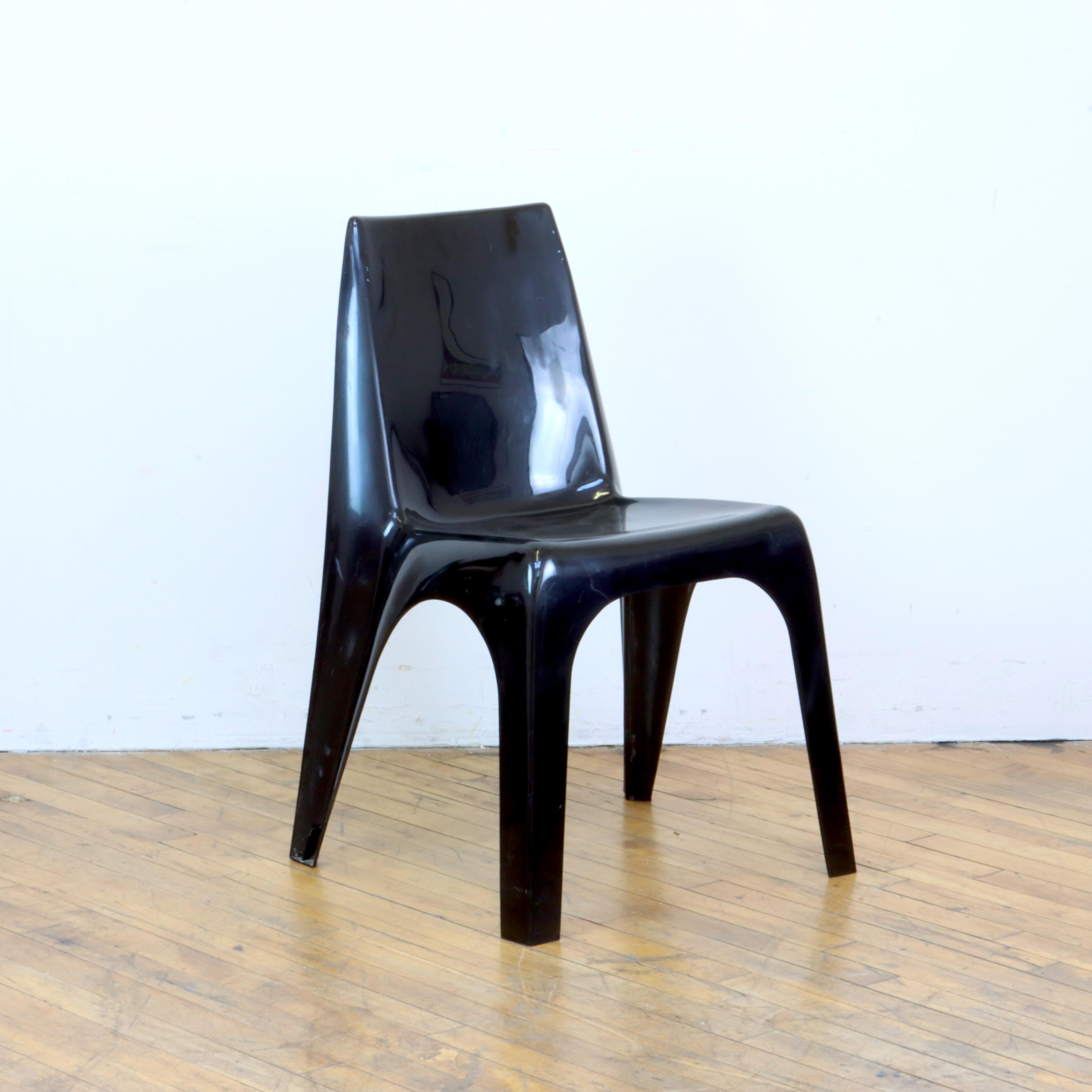 18” W x 17” D x 30” H
Seat height: 17”

The future was then. Pair of playful space age Borg Warner Kartell style plastic stacking chairs, 1970s. Black plastic.  Overall good vintage condition with minor age appropriate wear. Scratch in one leg