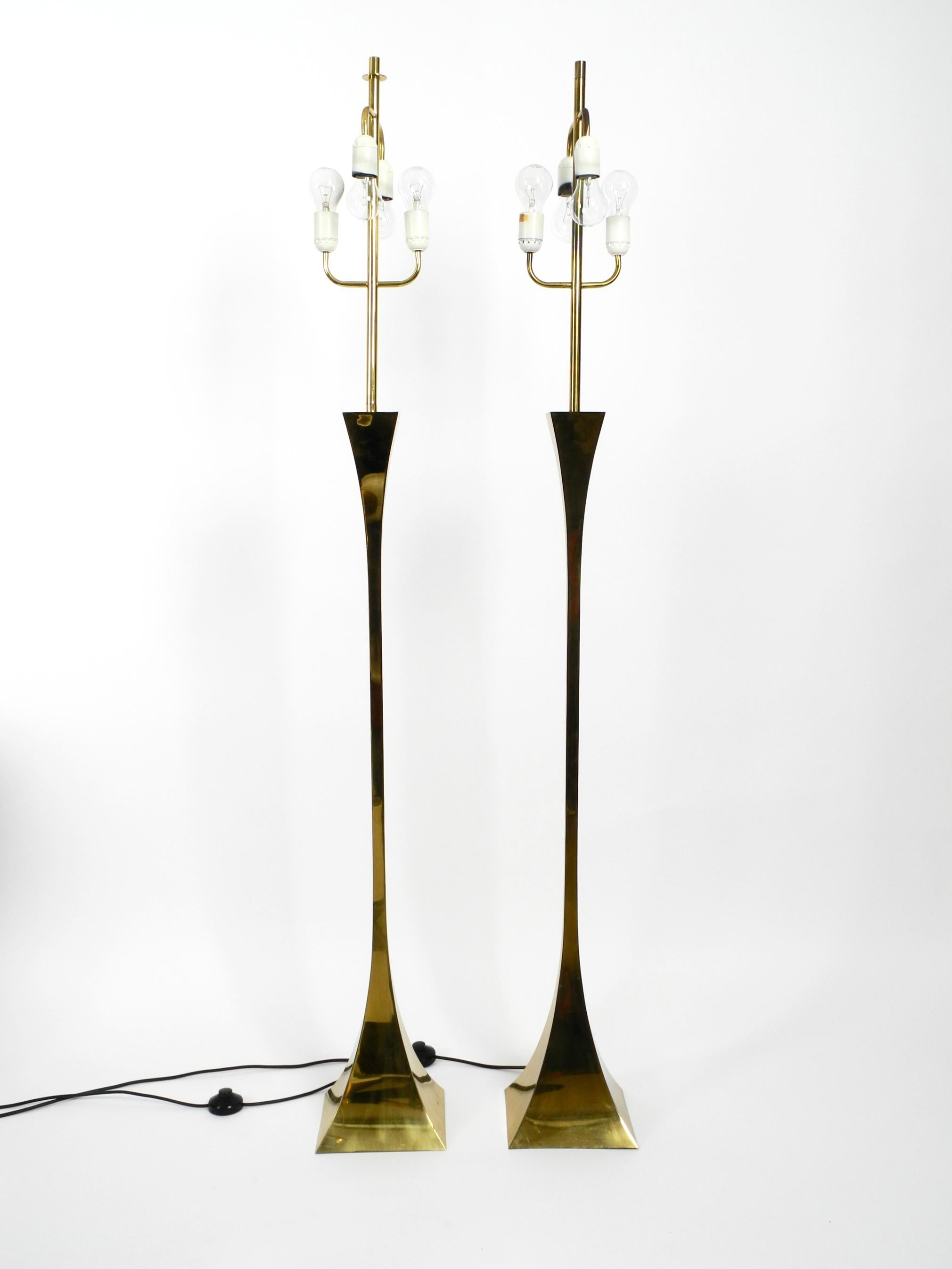 Beautiful rare pair of 1970's brass floor lamps.
Designed by Tonello and Montagna Grillo for High Society.
Made in Italy. Great, very elegant Italian design in its original vintage condition.
Base and rod are made entirely of brass. 
Beautiful