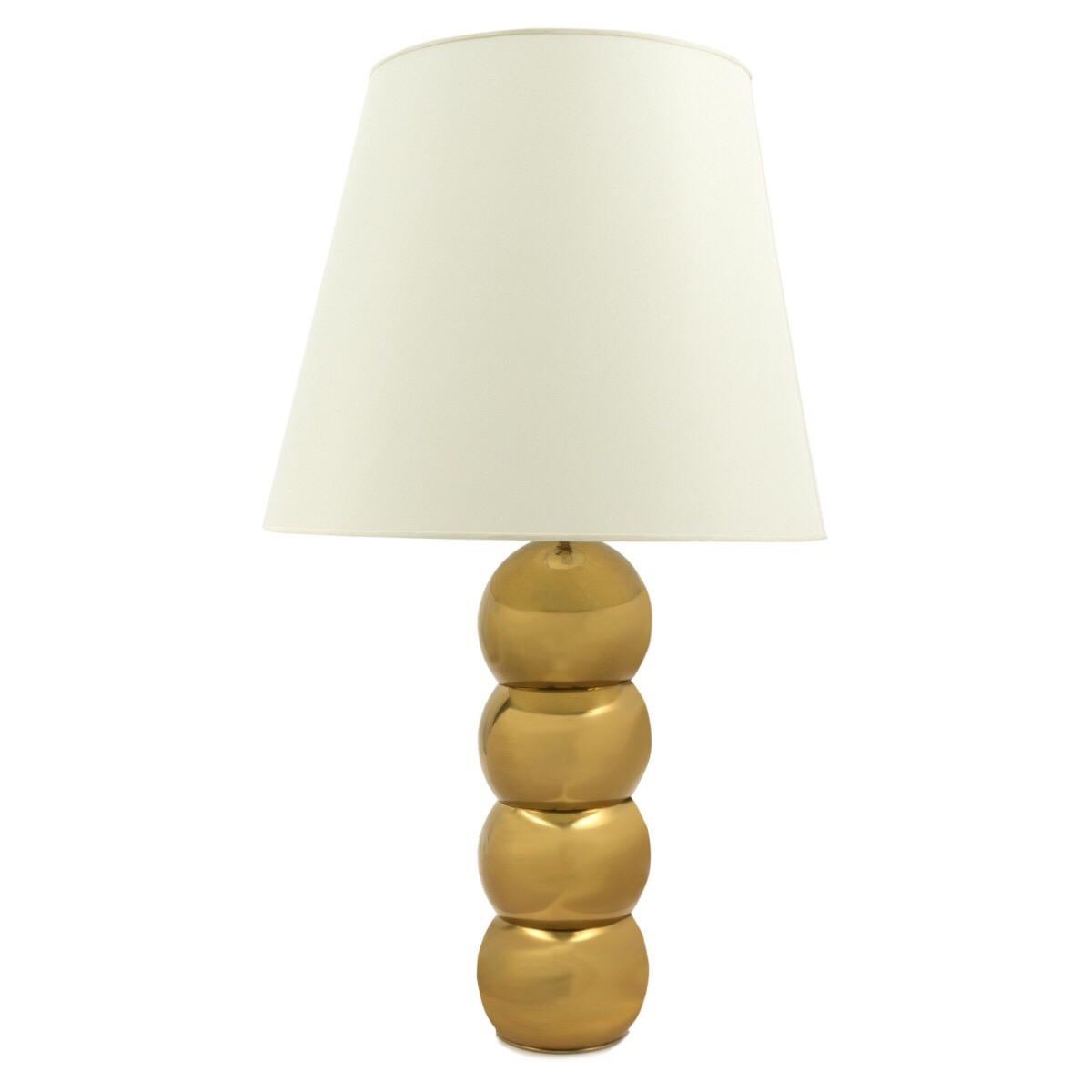A pair of table lamps with a stacked ball design in bronze finish. USA, circa 1970. Newly required for U.S. Includes two white paper shades as shown.

Dimensions:
7