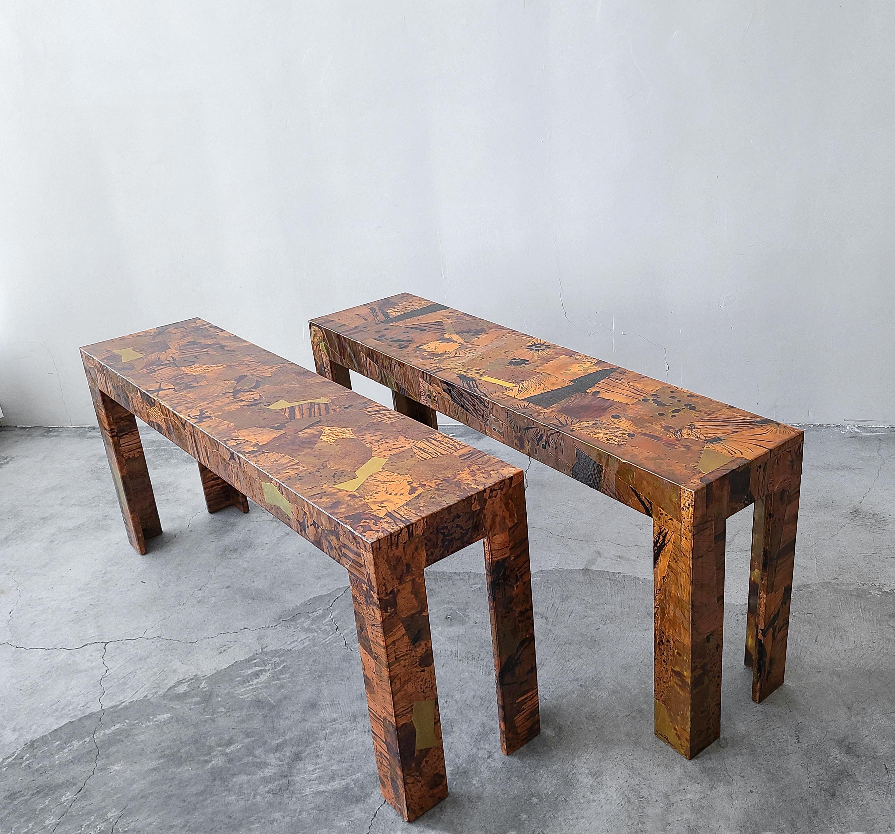 Great pair of 1970s Parsons style console tables in lacquered patchwork copper. Artist-signed.

Tables are in great shape overall with minimal wear from use. Small area of cracked lacquer on one table. See last image.

Willing to separate.