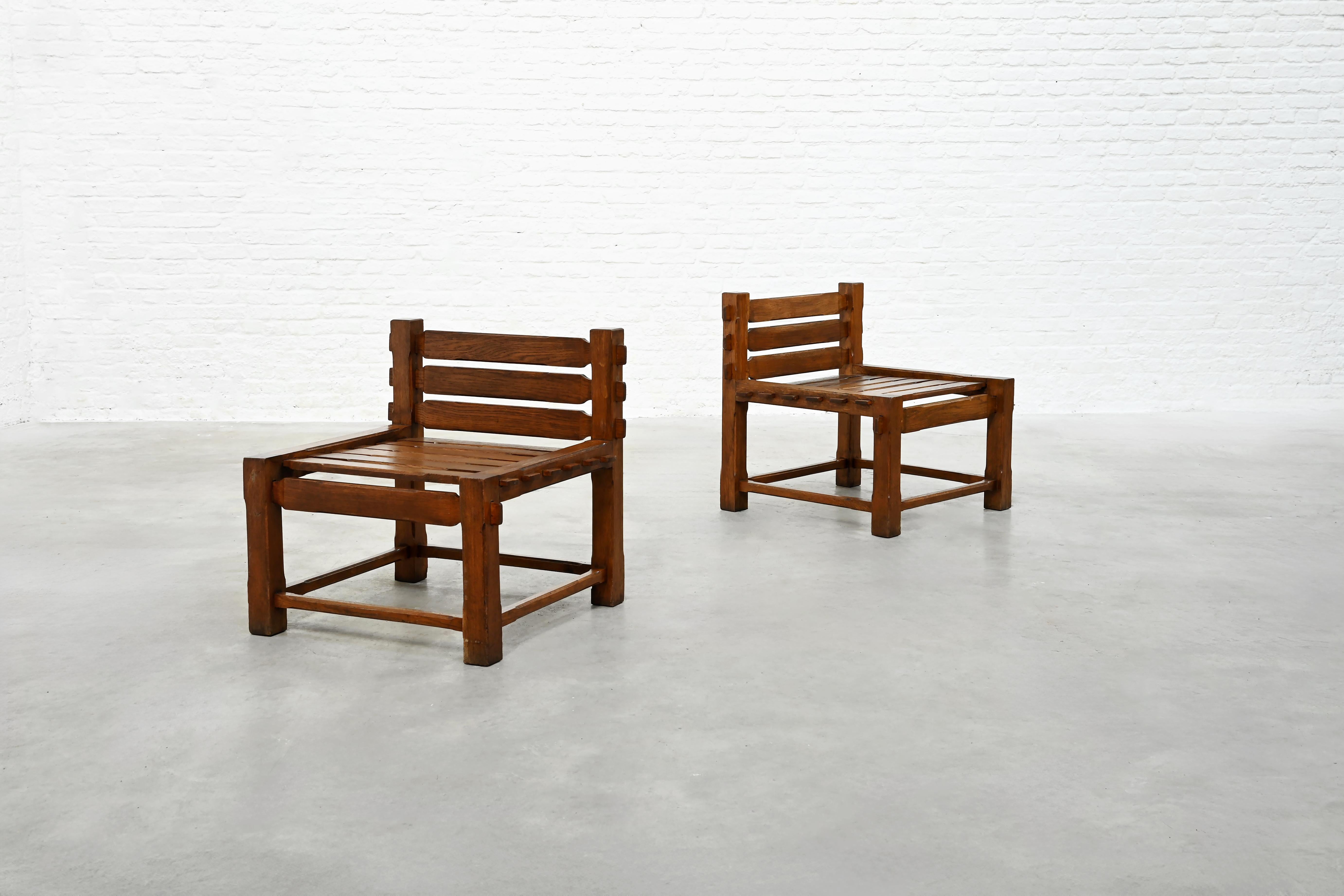 A striking pair of Brutalist side chairs, handcrafted in solid oak during the 1970s. These pieces capture the bold architectural spirit of the period, defined by their powerful geometric form, expressive joinery, and beautifully aged natural