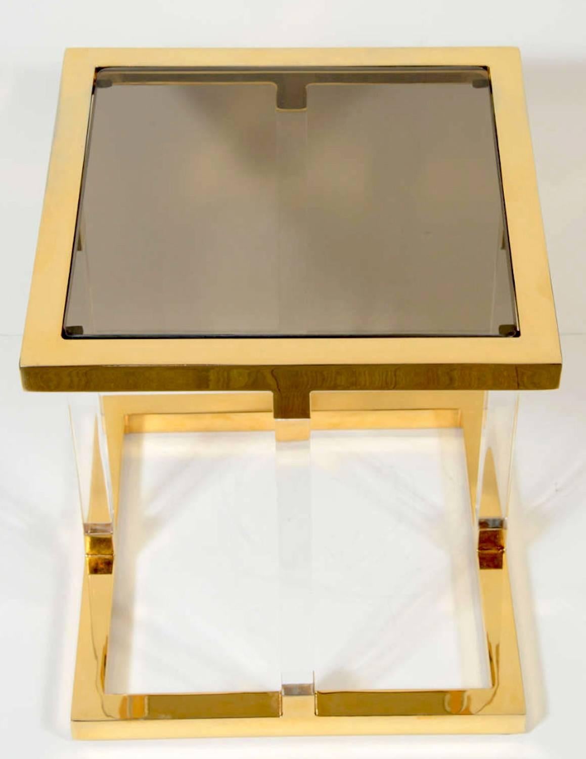 Pair of 1970s Charles Hollis Jones metric line side table. Polished brass frame with Lucite supports and a grey smoked glass top.