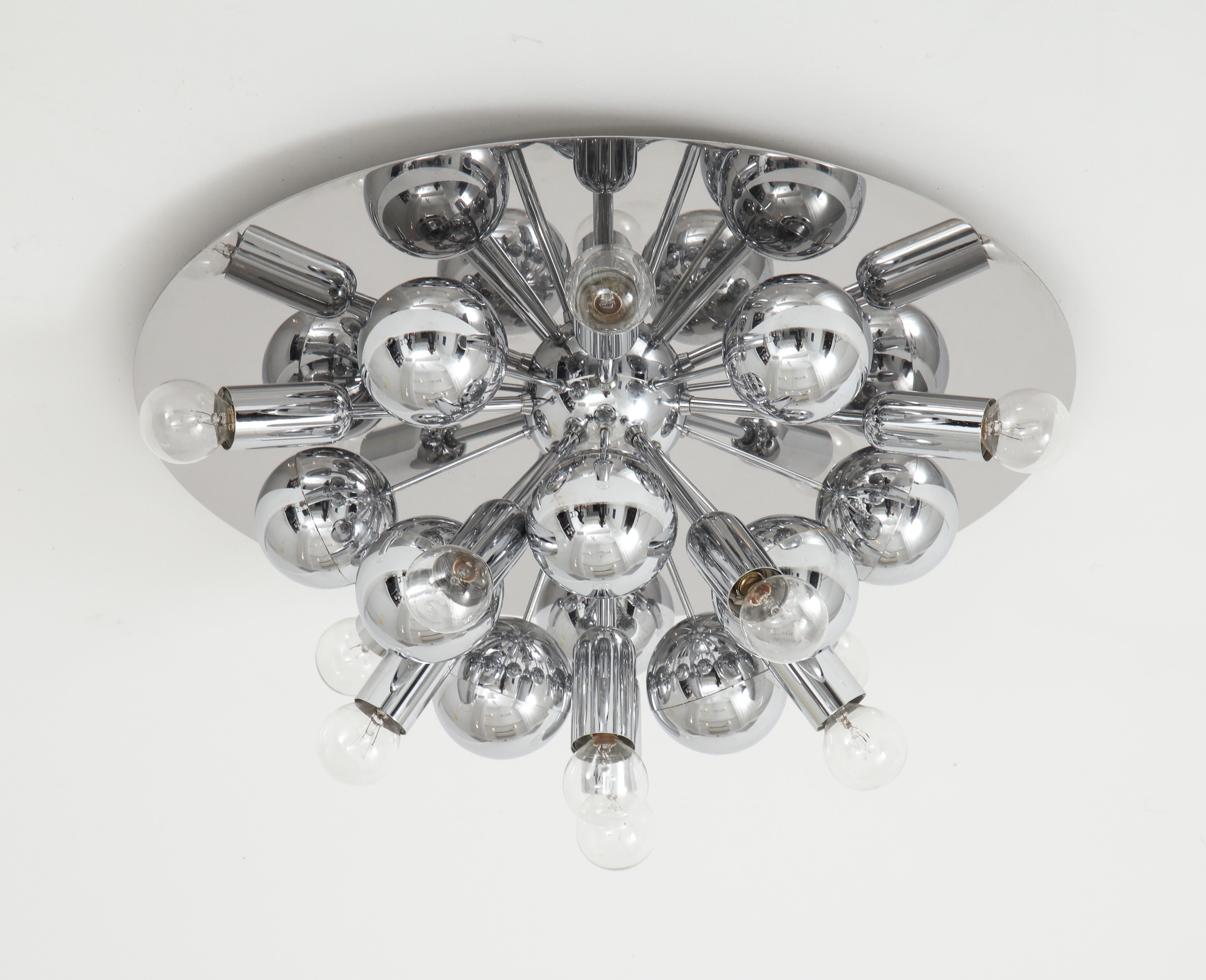 Pair of 1970s chrome sputnik lights by Cosack Leuchten.
This stunning pair of lights can be used as wall sconces or flush mounts
and they have been newly rewired but retain the original
E14 bulb sockets.