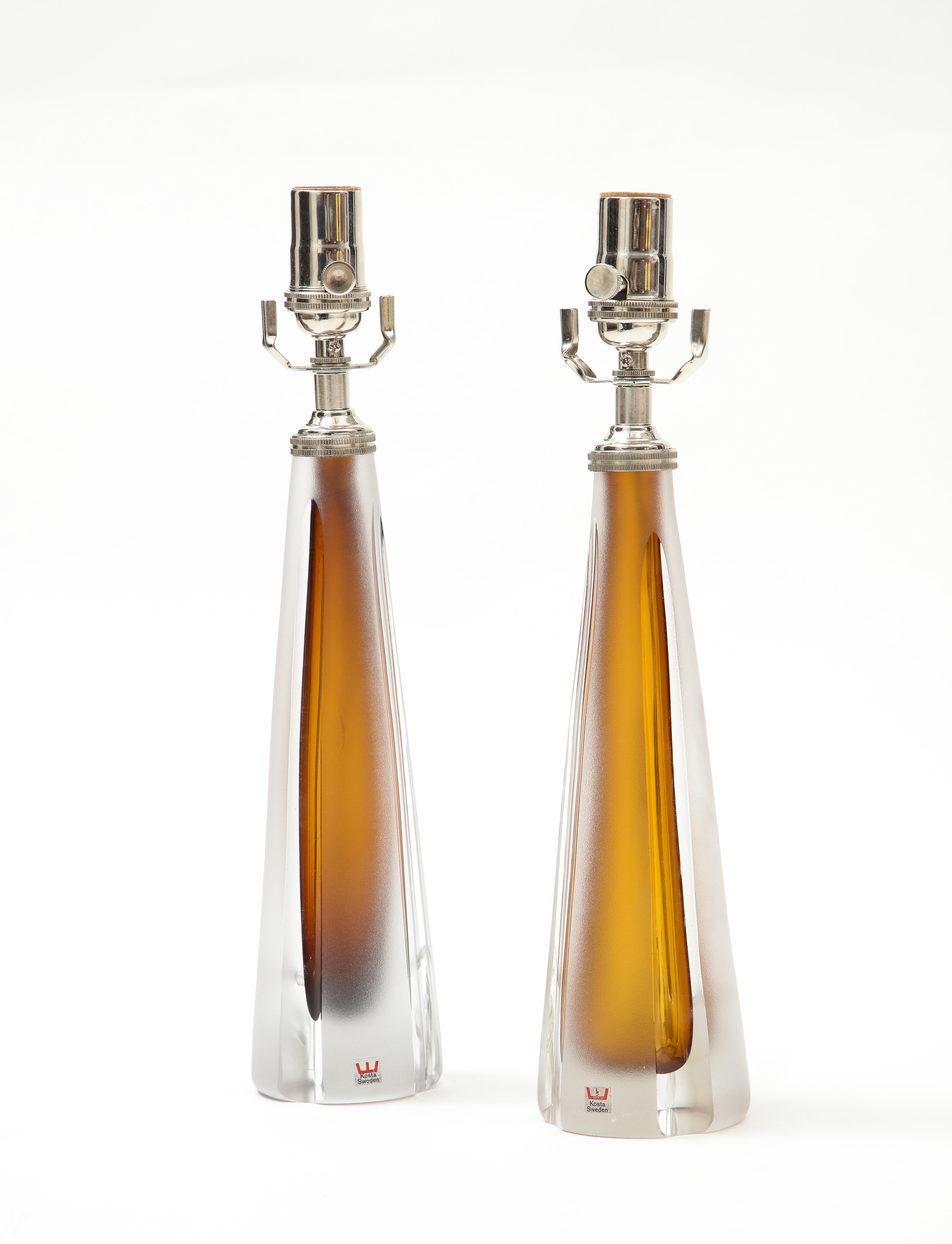 Beautiful pair of Perfume bottle shaped lamps in a stunning Cognac frosted colored glass which 
is paired with a smooth clear glass.
the lamps have been Newly rewired for the US with polished Chrome fittings and they take a
standard size light