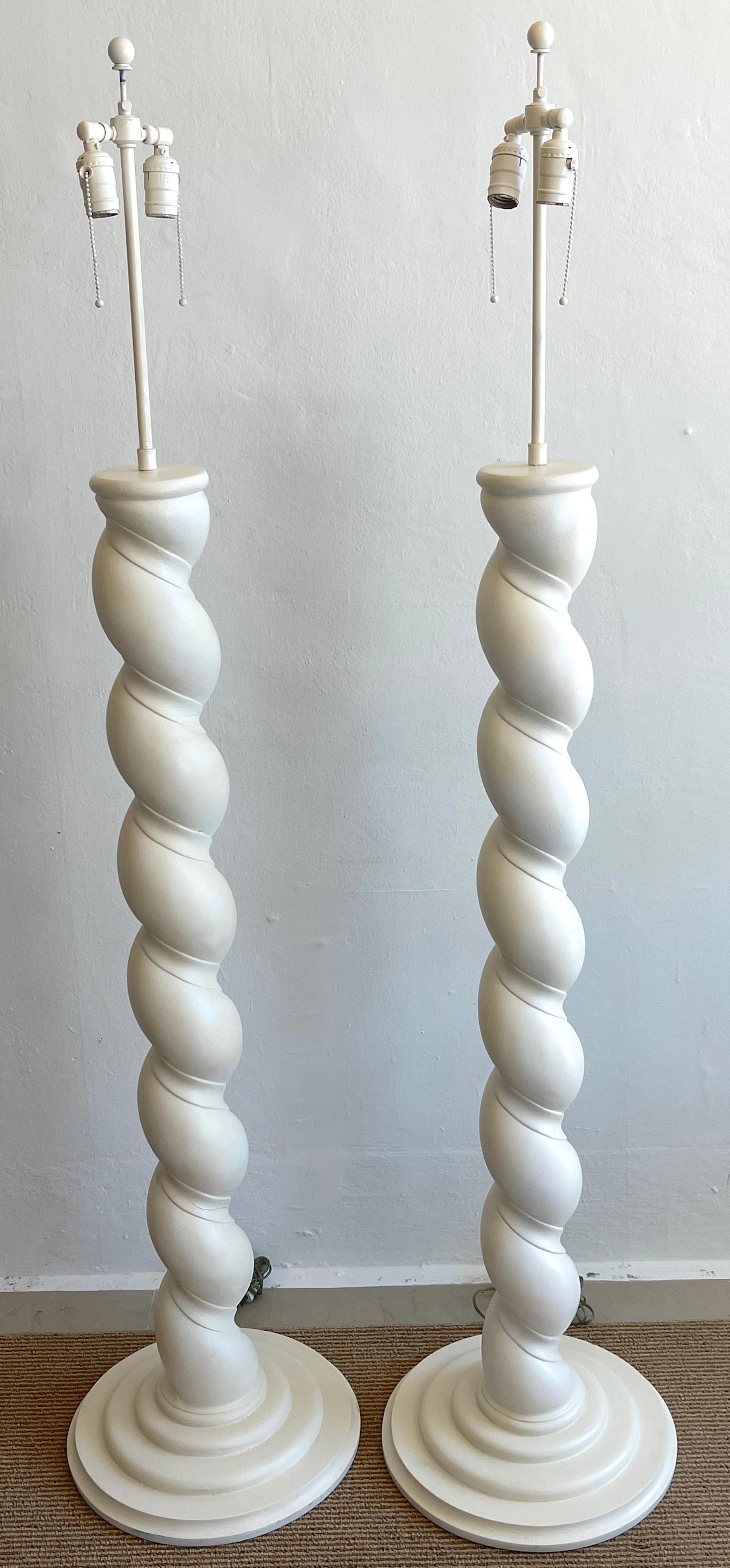 Pair of 1970s column plaster column lamps, in the style of Micheal Taylor 
Nice examples with detailed plaster and patina. New wiring. 
Each lamp stands 65-inches to the height of the finial, 50-Inches high tot the top of the column
Measure: