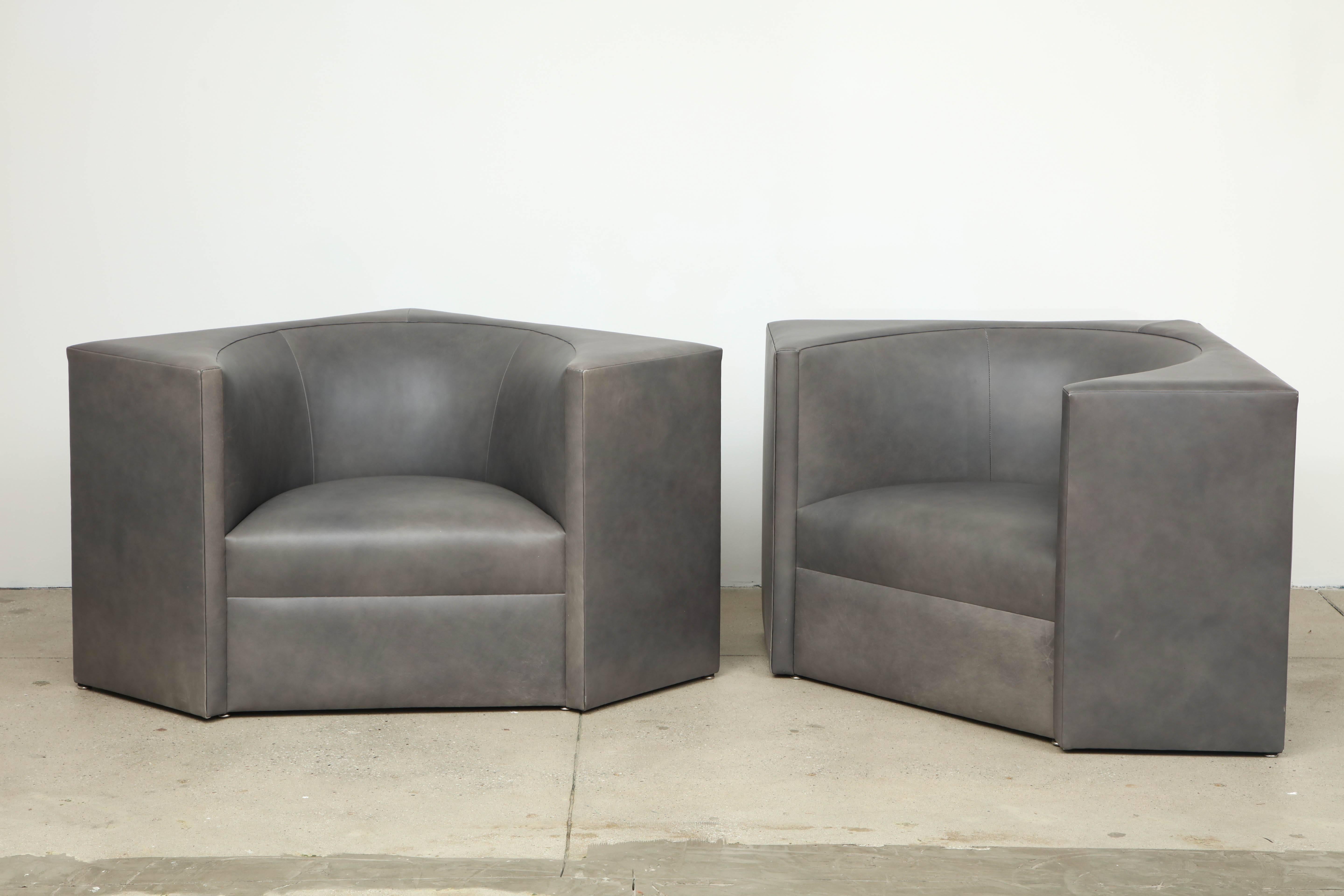 Pair of 1970s Cubic leather chairs.
The chairs have wonderful angled lines and they have been newly reupholstered in a soft medium slate gray leather.
 