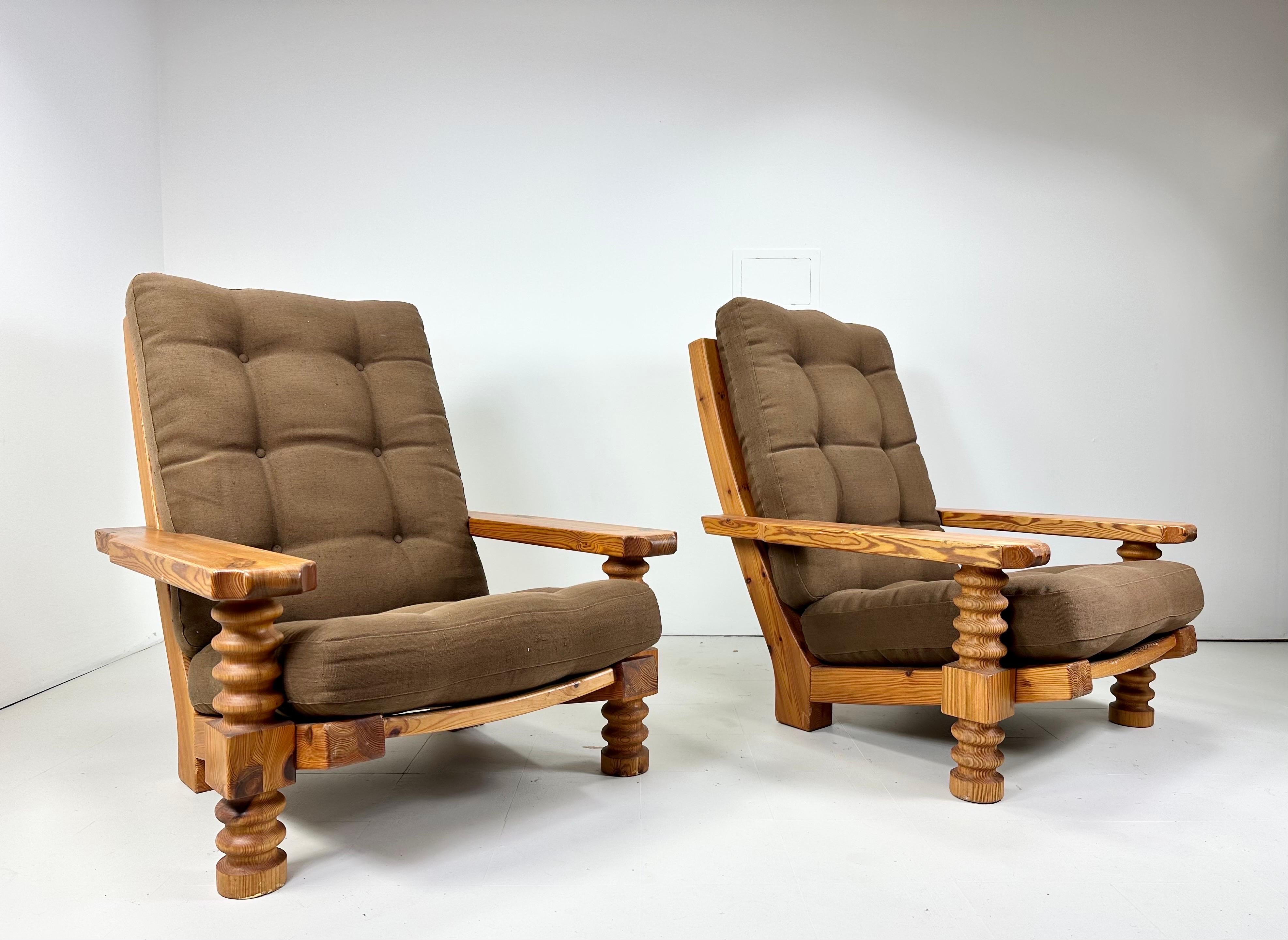 Pair of 1970’s lounge chairs. Large scale chairs made with solid pine. Chairs have figural grain patterns in the wood. Beautiful combination of rustic and modern. Made in Denmark.