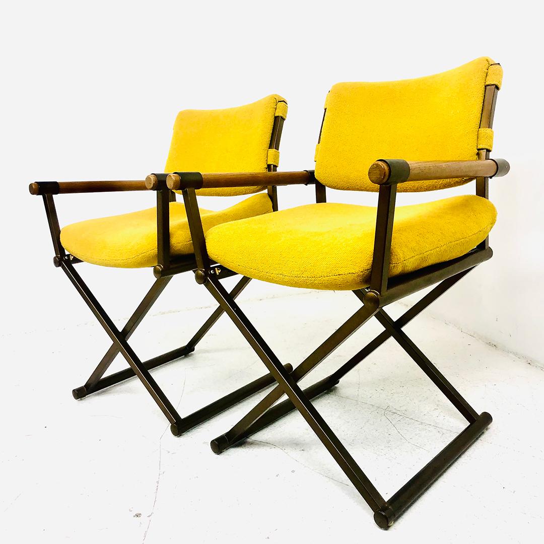 Handsome pair of vintage director's chairs in the style of Milo Baughman. Made in the 1970s, these chairs feature original yellow upholstery, solid oak arms, and sturdy, x-based frames.
Good vintage condition, some wear to upholstery due to age and