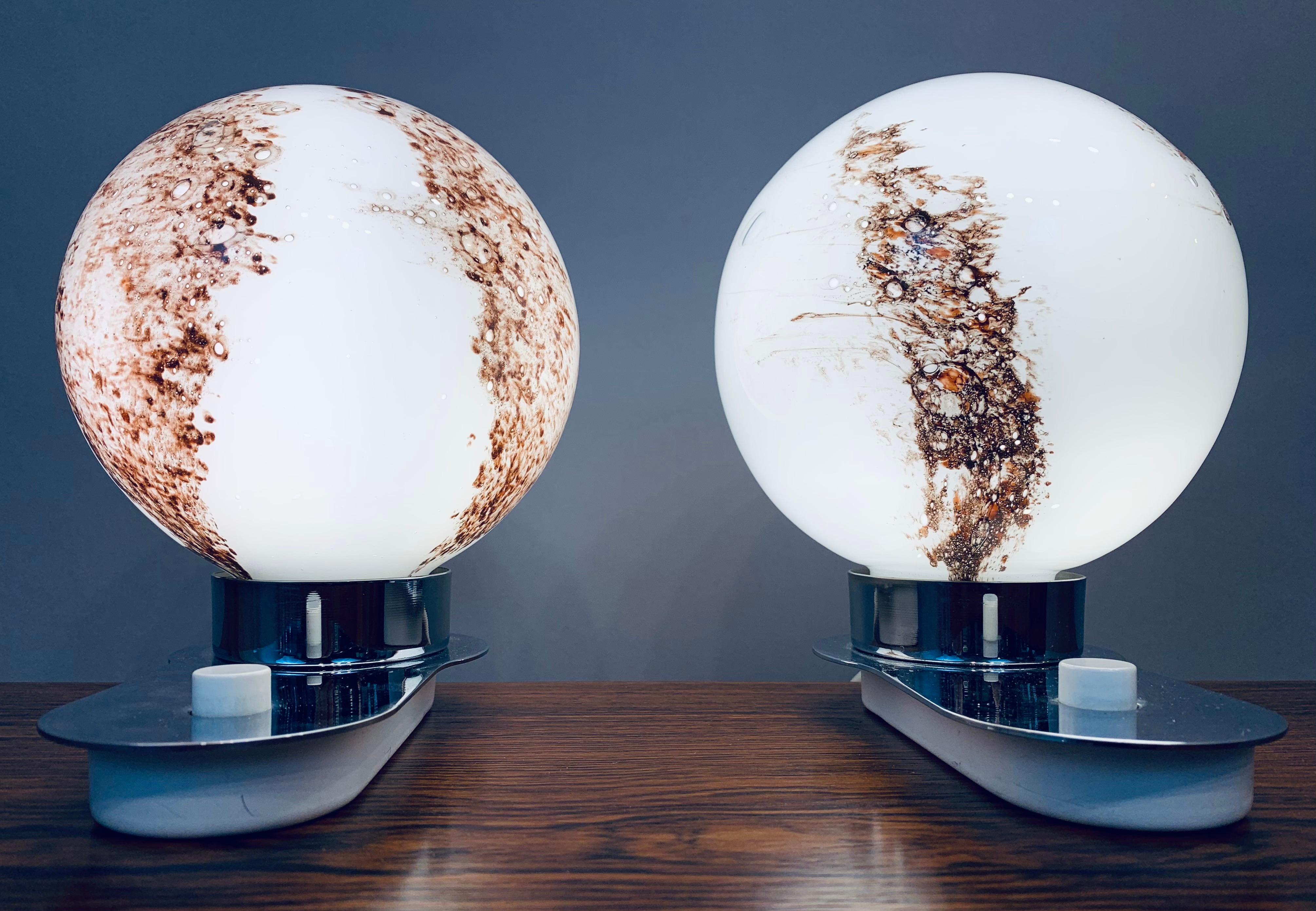 An interesting pair of 1970s German Doria Leuchten, illuminated, globe, decorative table lamps. Each globe sits on a chrome base with a white push button on/off switch. The lamps require a single E14 pygmy screw-in bulb. The globes screw off the