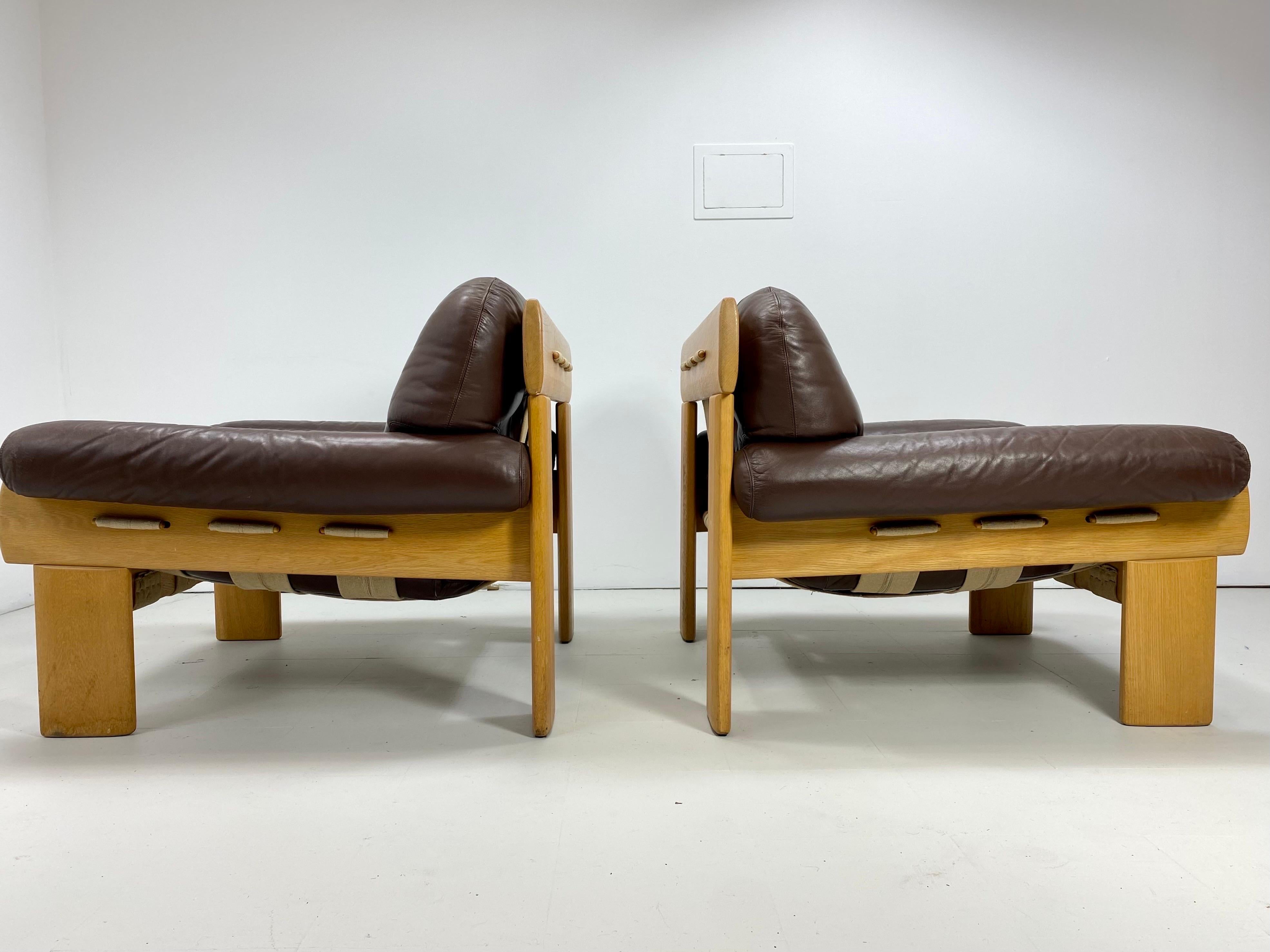 Pair of Esko Pajamies “Africa” chairs for Asko. Finland. Unique chairs made of oak, brown leather and wide canvas strapping. 1970’s

Delivery To NYC $425. Please inquire.