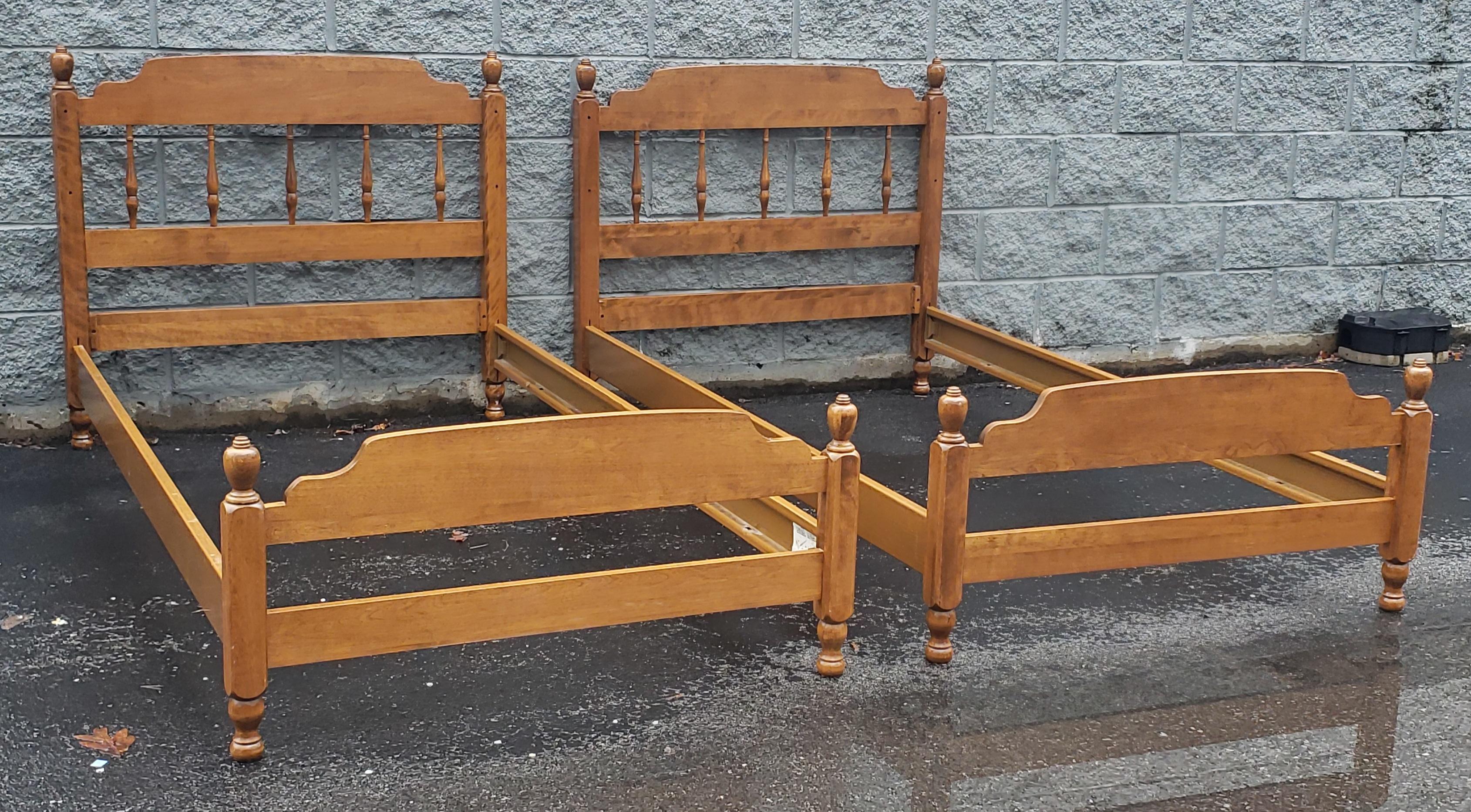 A rock solid pair of 1970s solid Heirloom Maple twin size bedsteads. Made out of solid Maple. Measure 42