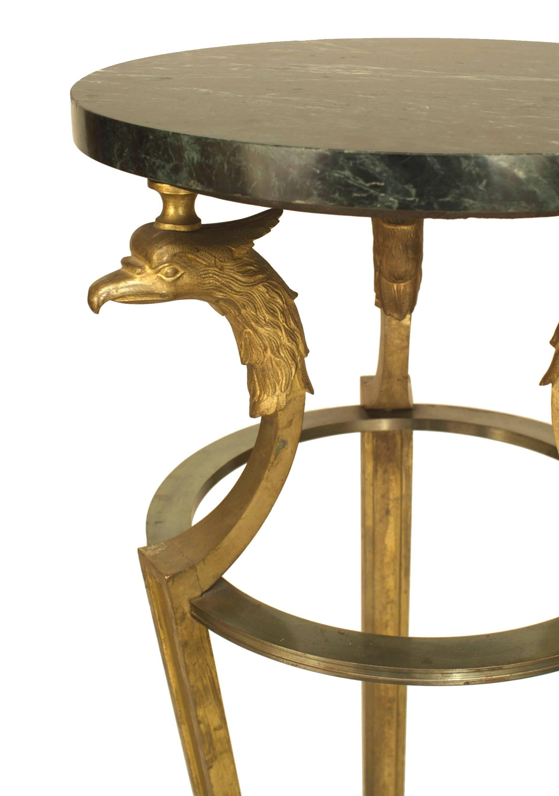 Pair of French Empire Neo-classic style gilt bronze 3 leg pedestals with bird heads supporting a round grey marble top. (Maison Jansen, 1970s)
