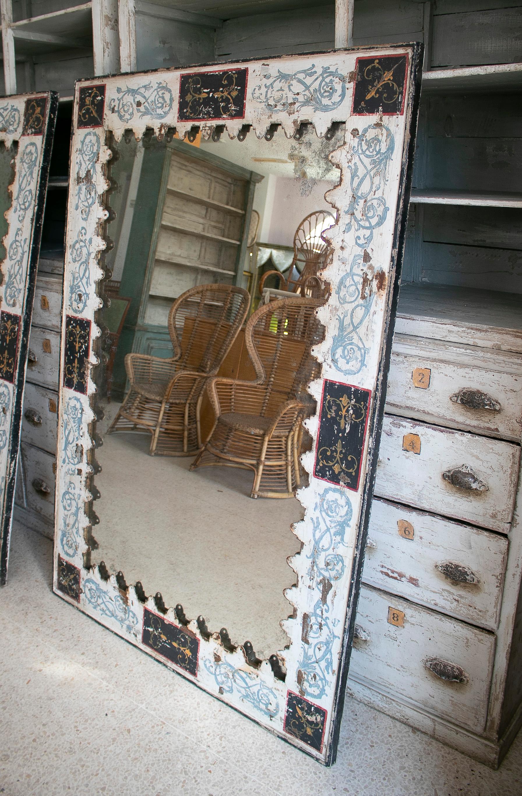 Vintage pair of 1970s French painted iron wall mirrors.