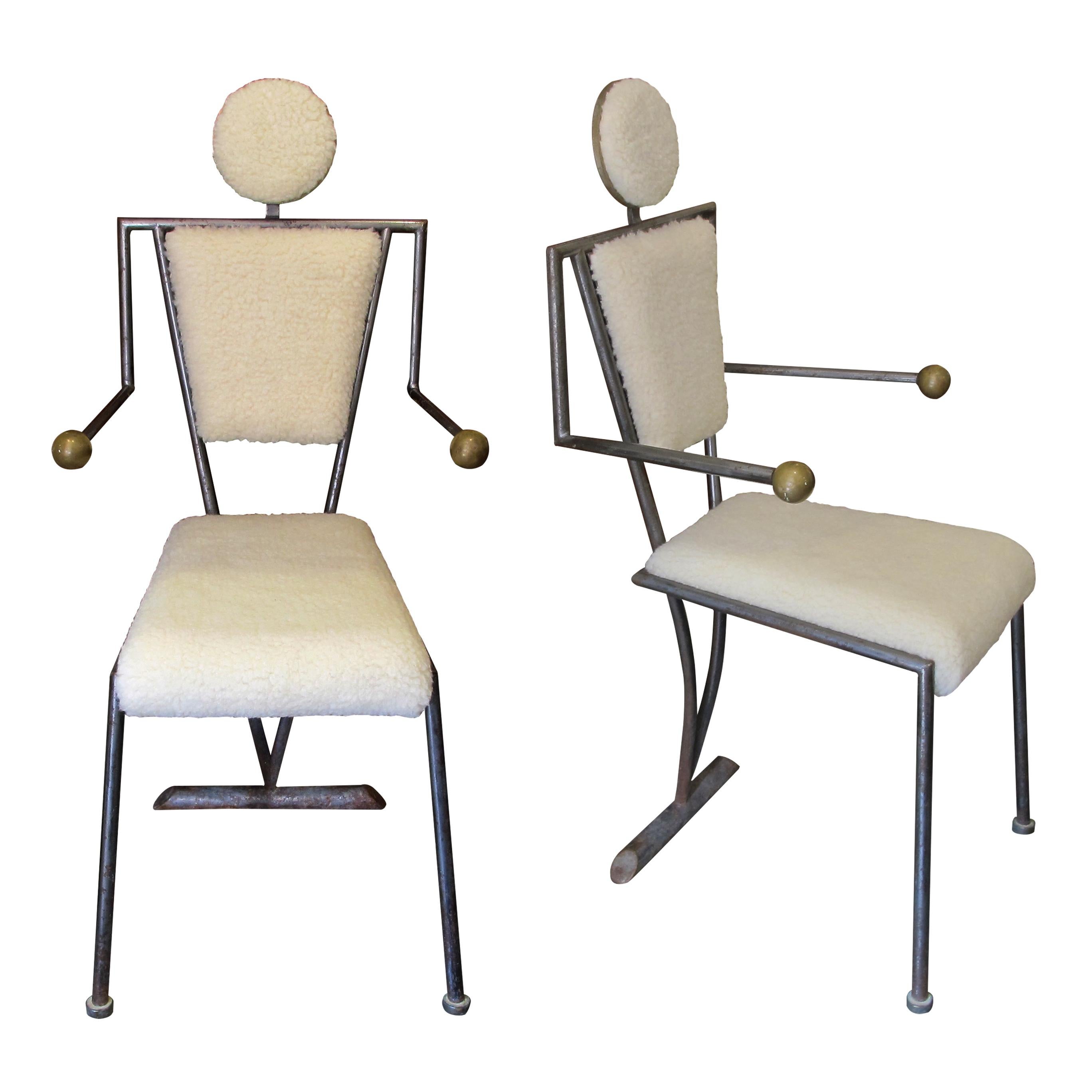 A pair of very unusual occasional chairs designed to mimic a person sitting down making them a real talking point. The armchairs have been newly reupholstered with a lamb-mix fabric and are very comfortable. The frame is very well-balanced and