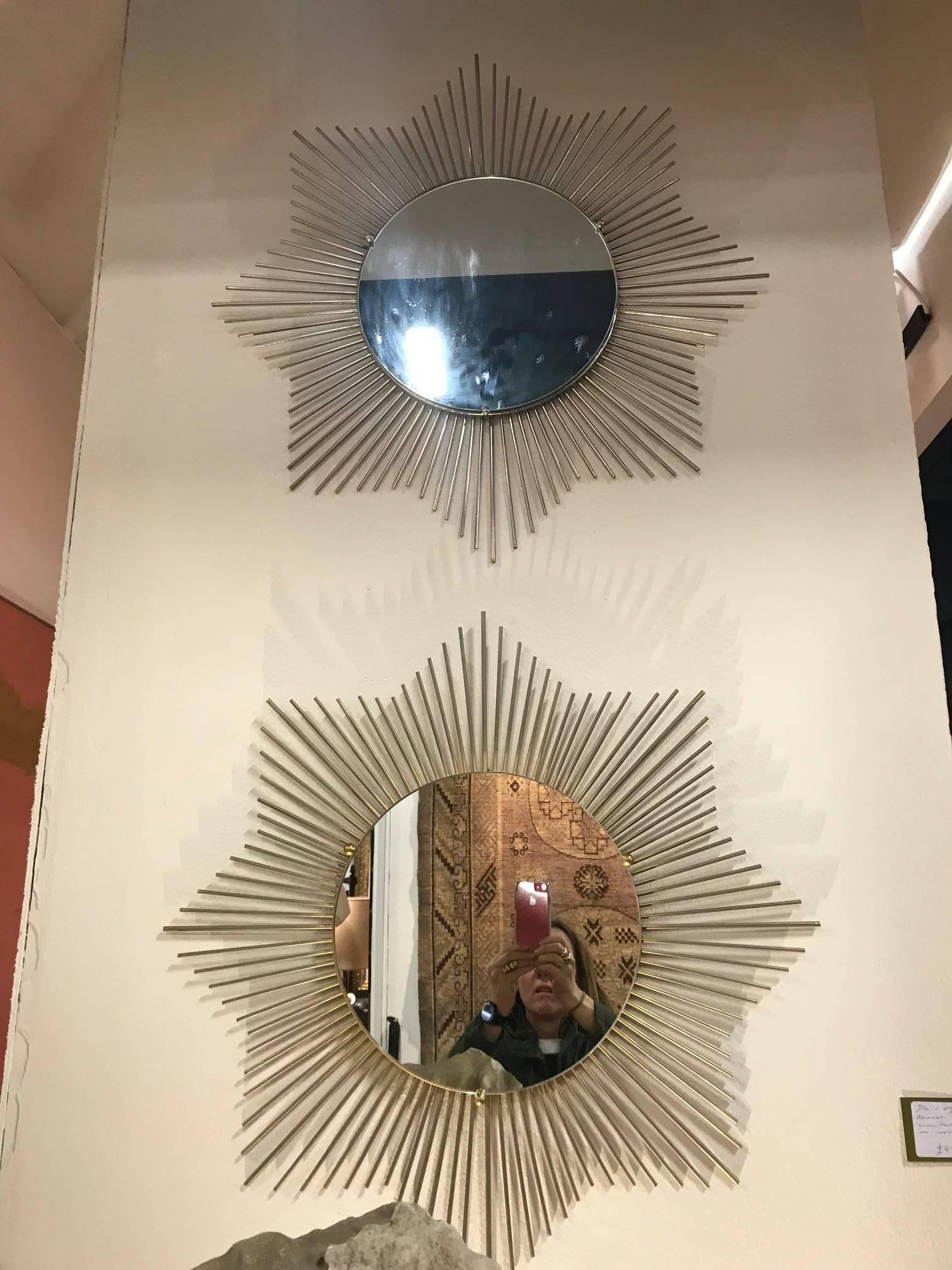 A pair of white metal sunburst octagonal shaped mirror, French, circa 1970s.