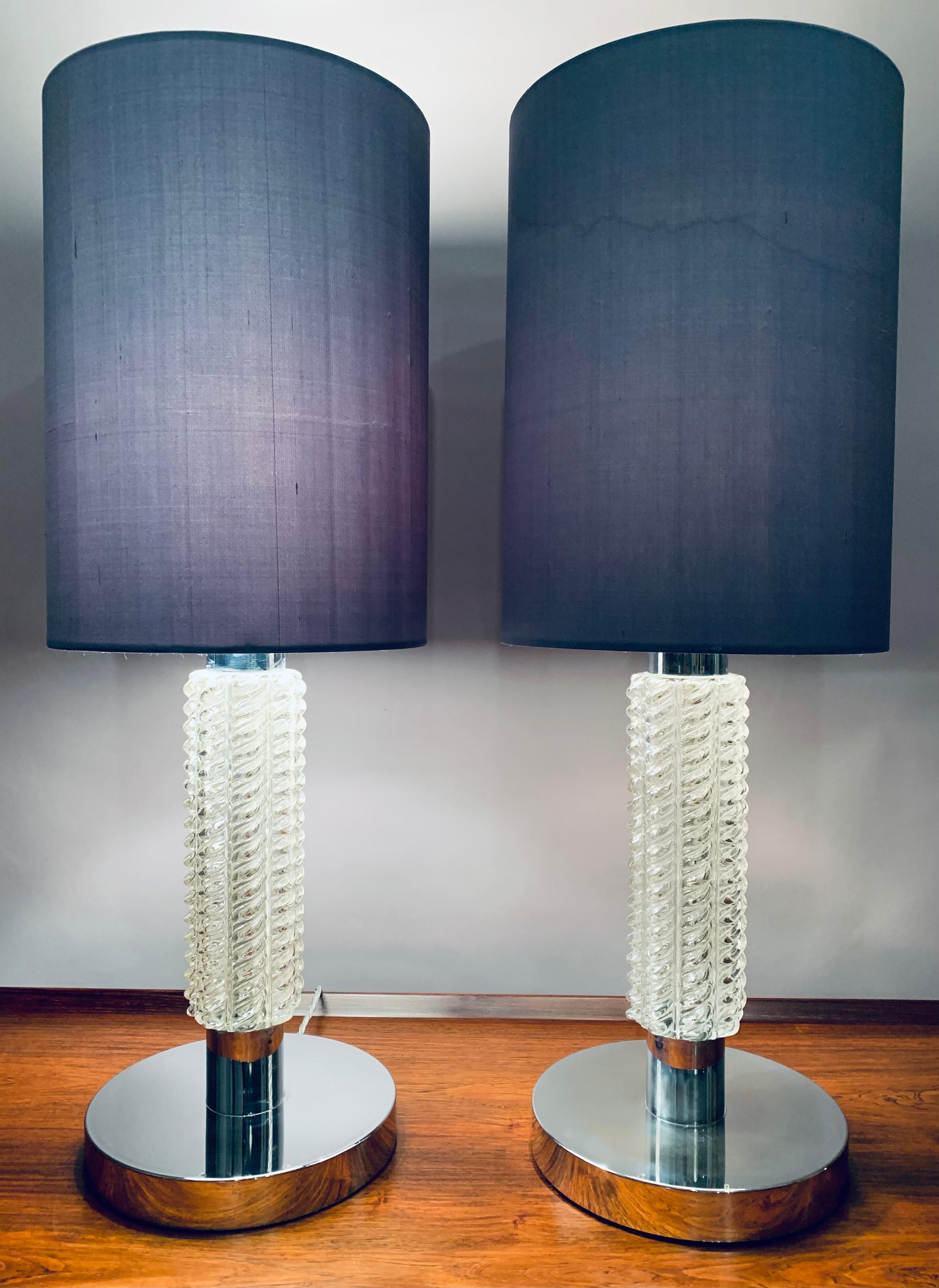 Pair of 1970s German glass and chrome circular table lamps.  Designed by Richard Essig.  A single E27/E26 bulb is required in each one.  The lamps have been rewired with a silver silk flex with the on/off switch fitted along it.  In very good