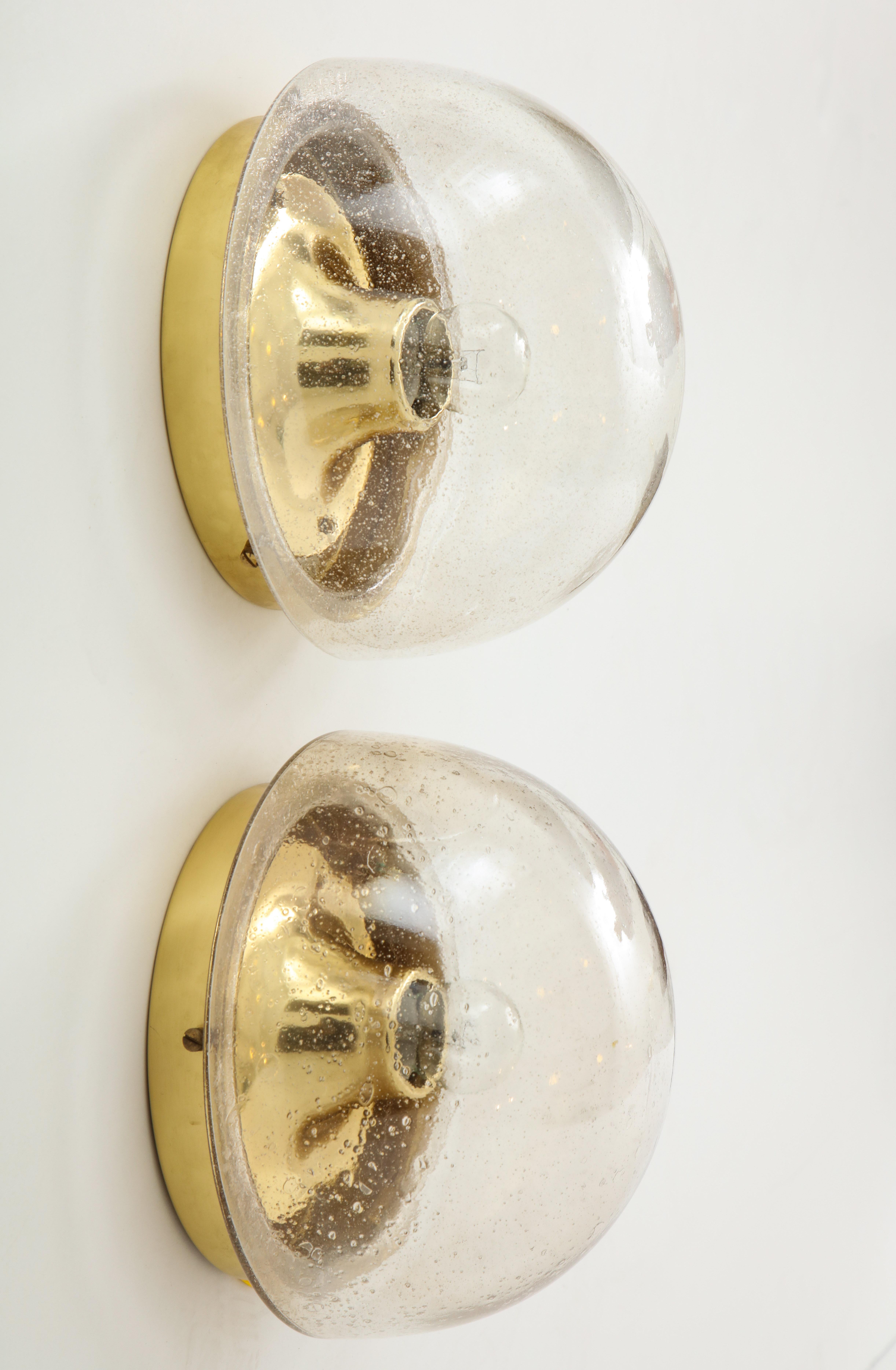 Pair of 1970s Murano glass dome sconces by Limburg.
The glass dome fits on to a brass backplate with a single
light source which has been newly rewired for the US.