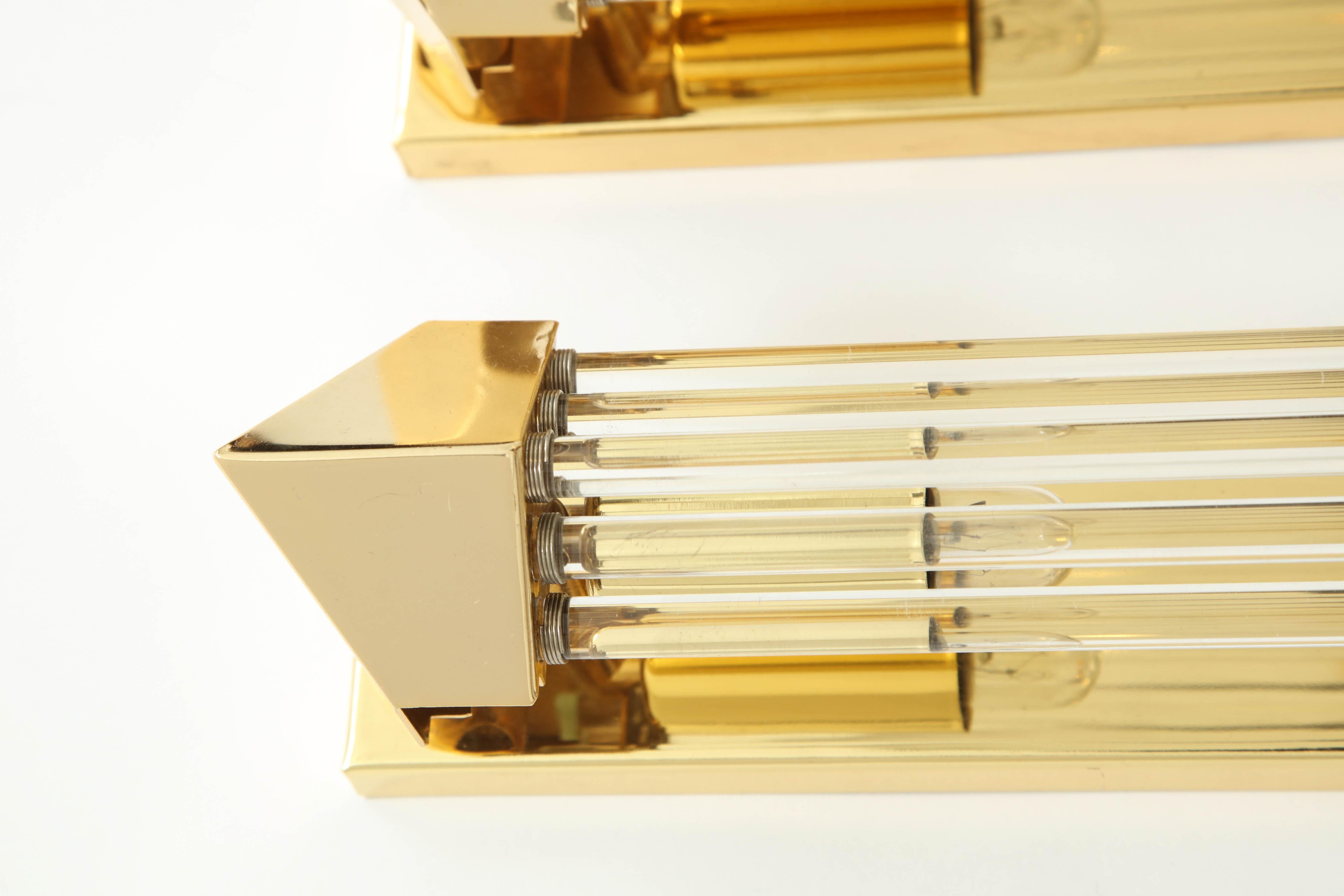 Pair of 1970s brass sconces with glass rods.
The sconces have two candelabra light sources per sconce.
 