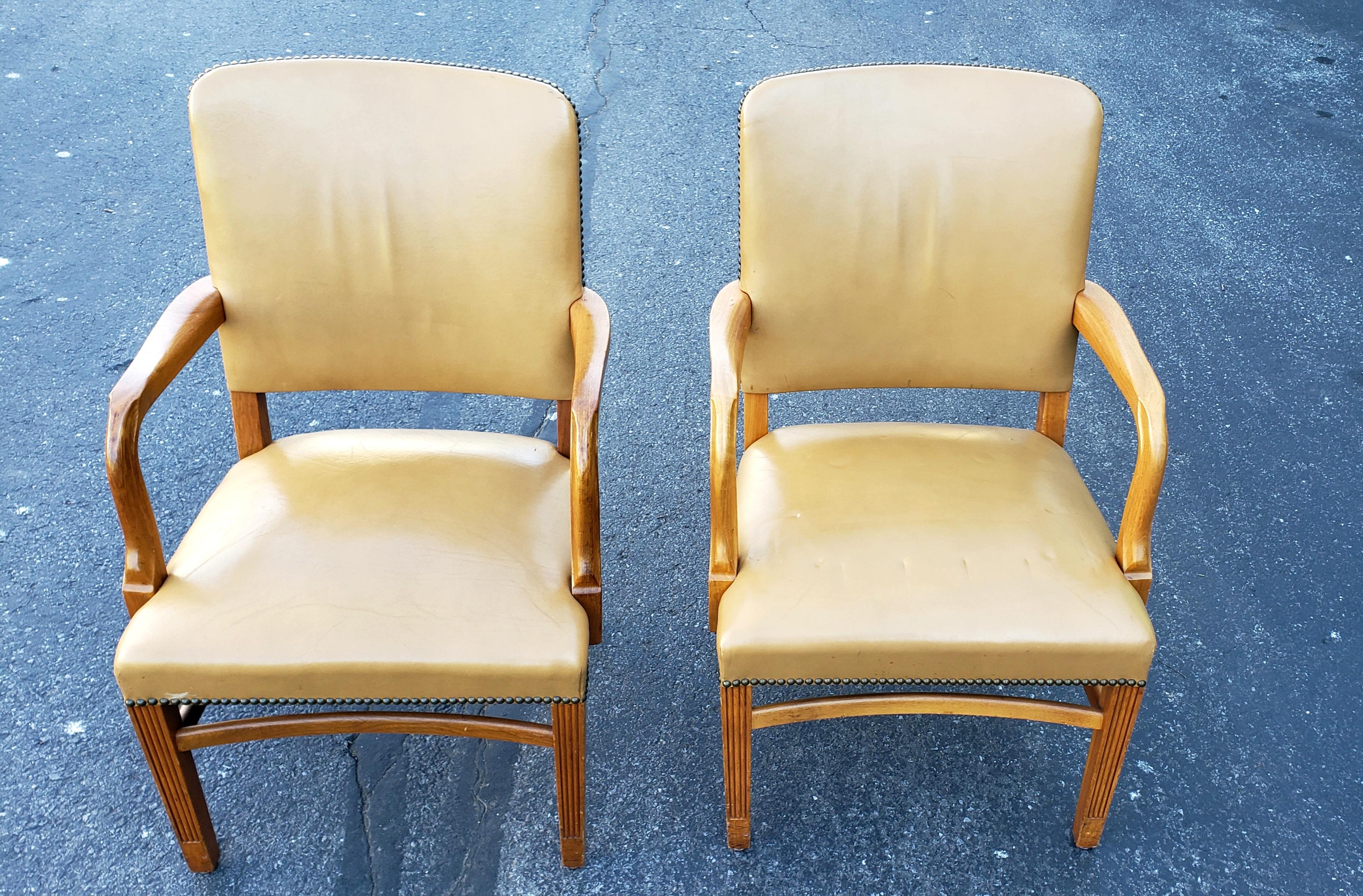 Pair of 1970s Gunlocke fruitwood and leather armchairs. Tan top grain leather . Very firm seats. Very comfortable.