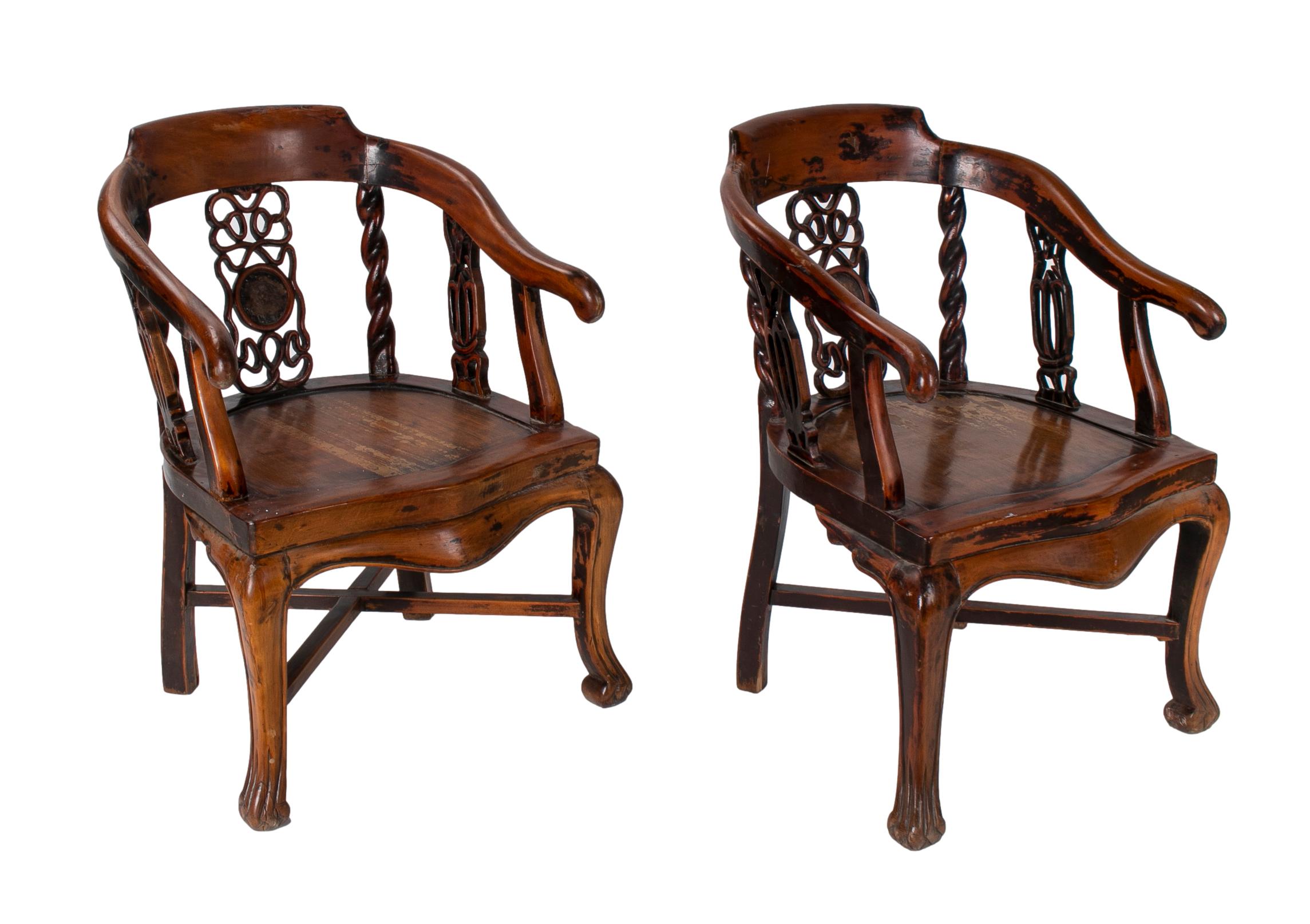 Pair of 1970s hand carved Chinese wooden armchairs.
