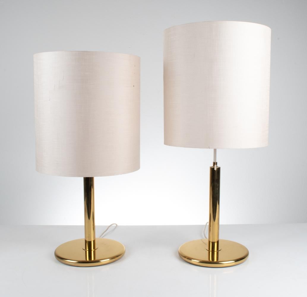 Introducing a dazzling pair of brass table lamps by the esteemed German lighting manufacturer Kaiser Leuchten. Crafted with precision and artistry, these table lamps are a tribute to the exuberant spirit of the Hollywood Regency and Art Deco Revival