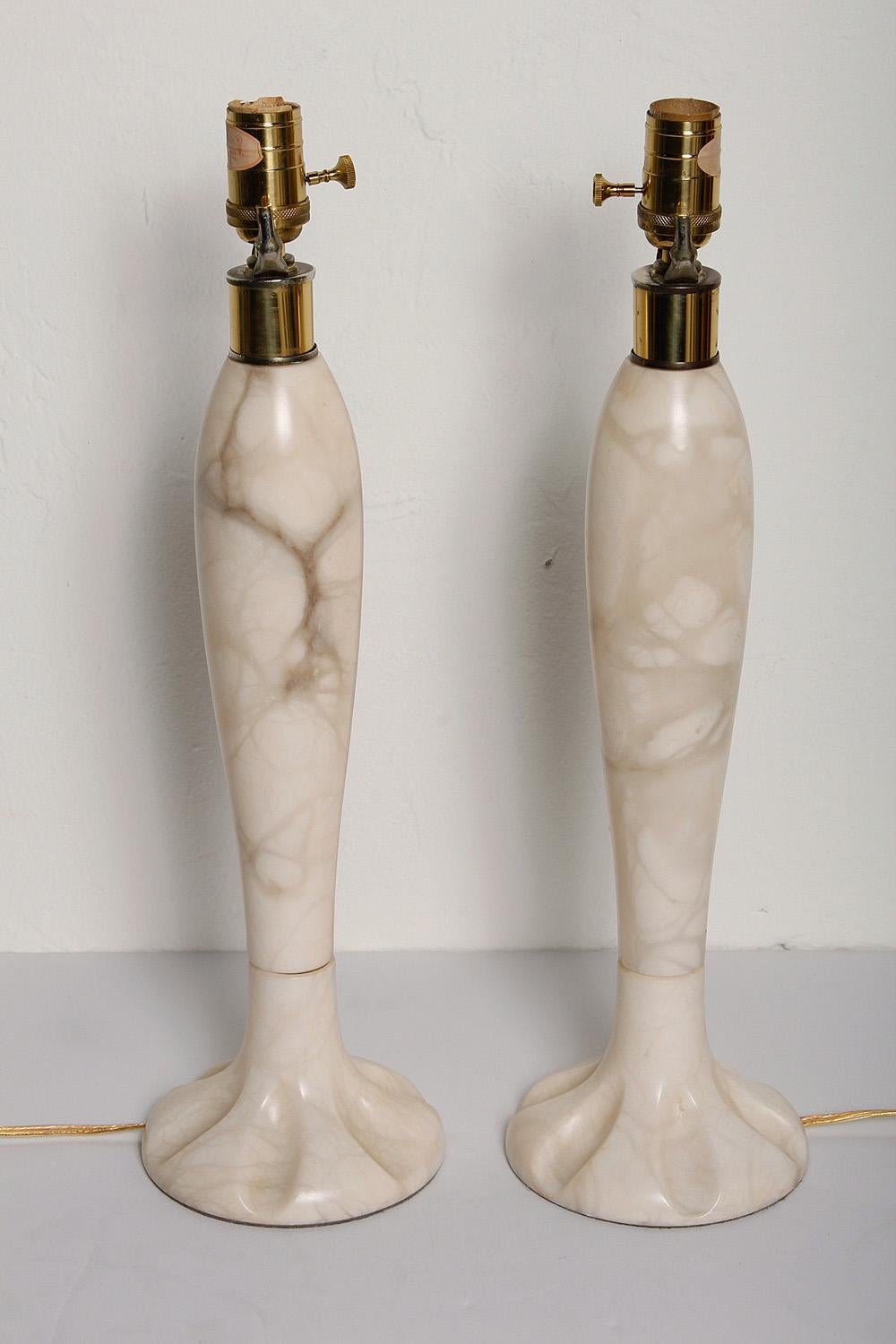 This 1970s pair of Italian alabaster lamps shine in soft tones of white, cream, and taupe. New U.S. wiring. Height measurement below is to top of socket.