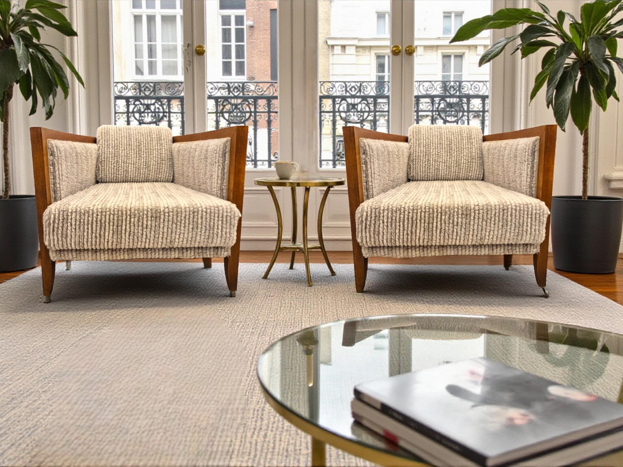 This pair of Italian Art Deco–inspired lounge chairs from the 1970s combines sculptural presence with exceptional comfort. Their angular wooden frames create clean, architectural lines, while the newly reupholstered seats—covered in a warm,