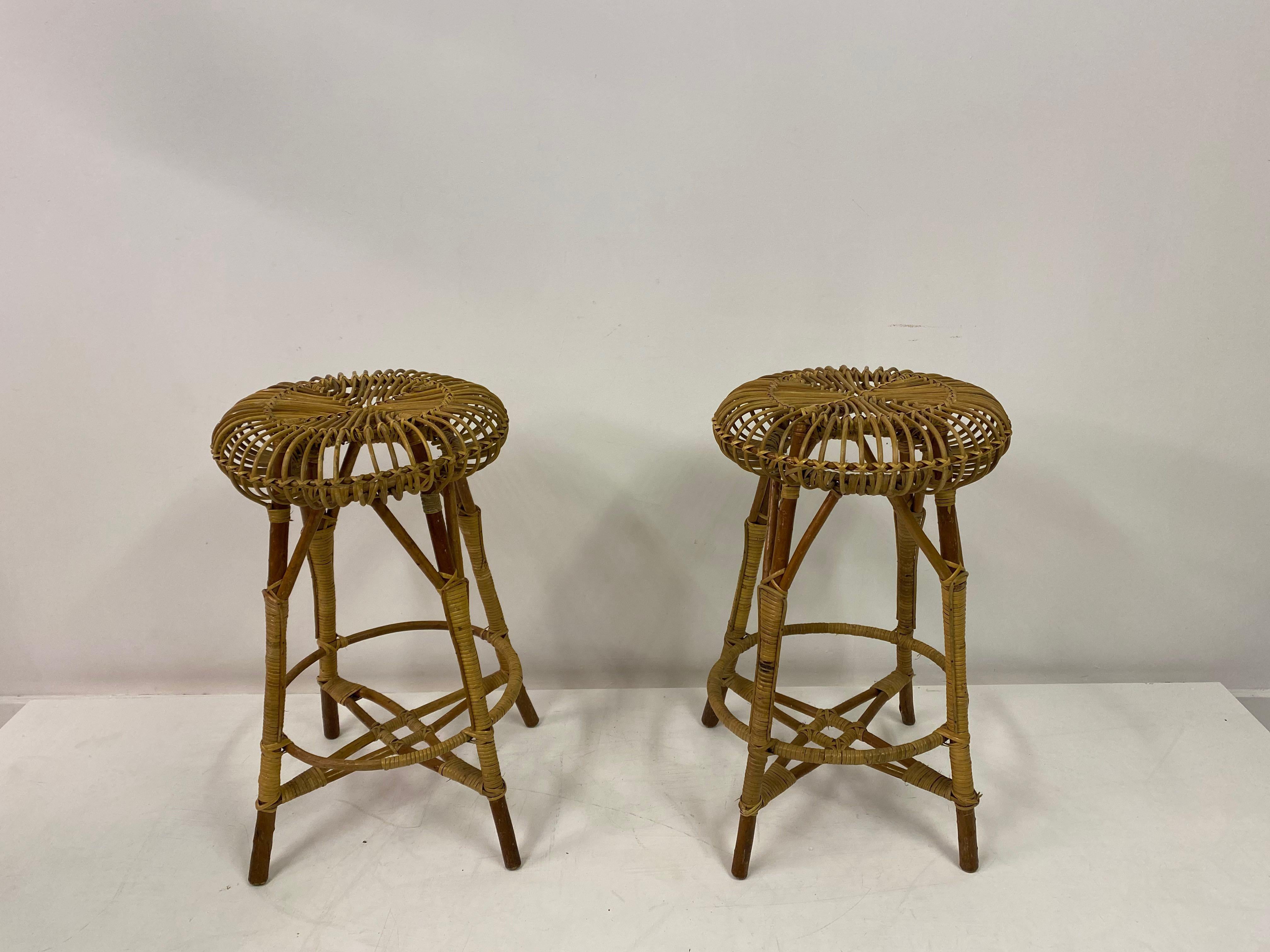 A pair of bar stools

Bamboo and wicker

Italian 1960s/1970s.
