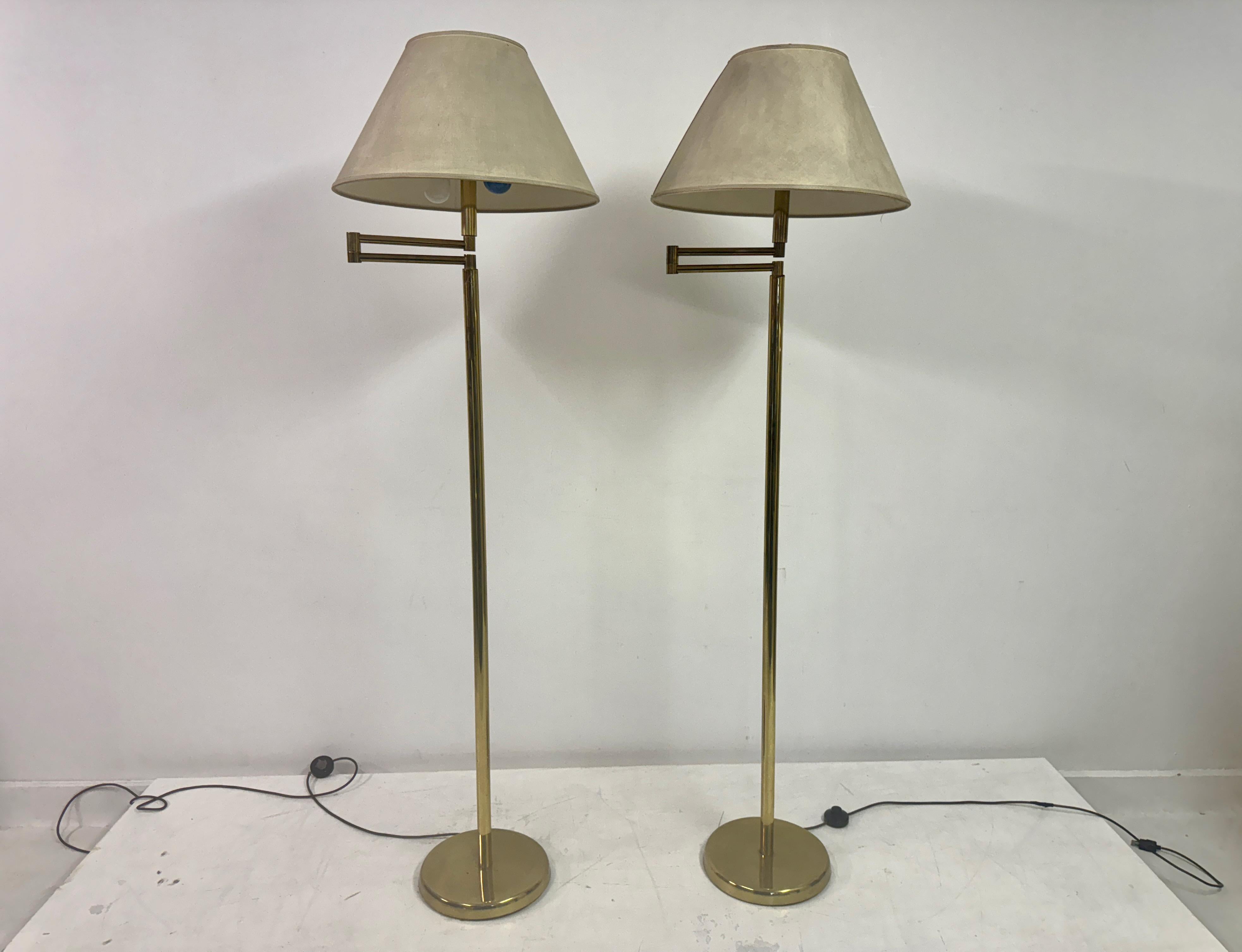 Pair of floor lamps

Swing arms

Brass

Original shades but are soiled

Dimensions are without shades

Italy 1970s
