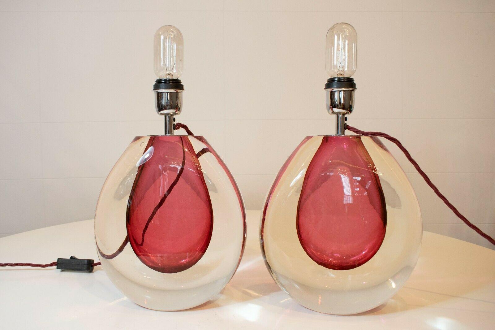 A beautiful pair of 1970s Italian Murano glass lamps with pink centre and clear glass.