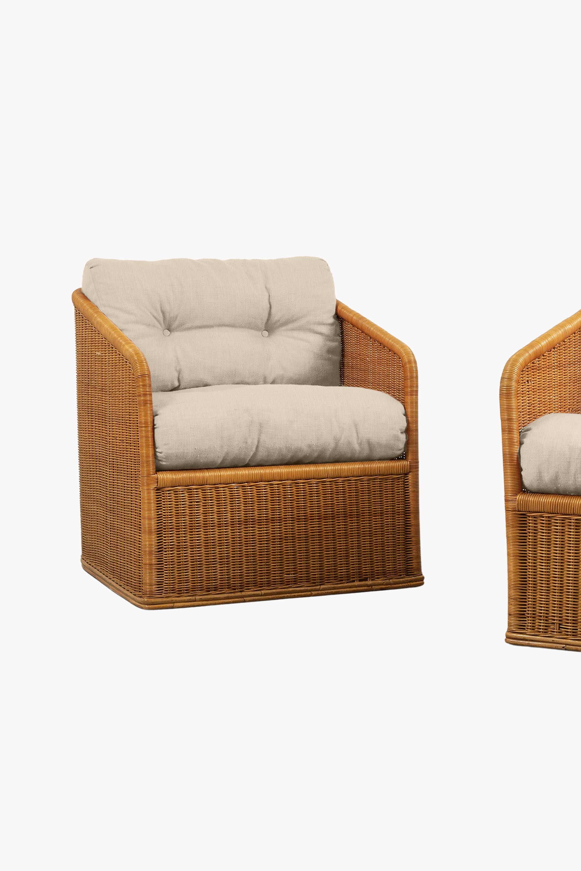 A stylish pair of rattan armchairs. Made in Italy c. 1970.

In excellent condition. Price includes re-covering in customer's own material. 
Current upholstery is a modern peach coloured linen. The cushion images here have been re-coloured to show an