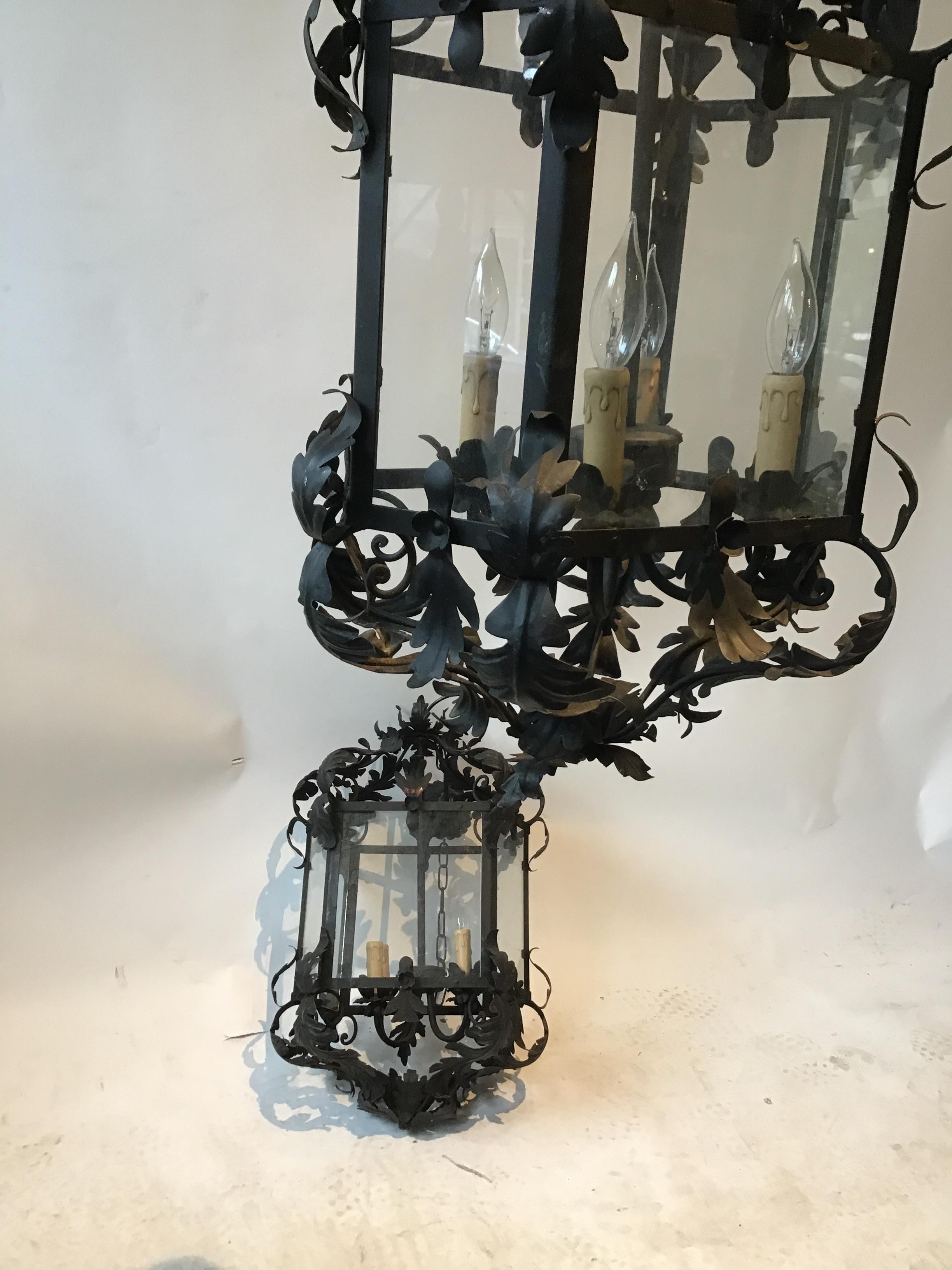 Pair of 1970s wrought iron Italian lanterns. Unique shape. Wide, but not to deep.