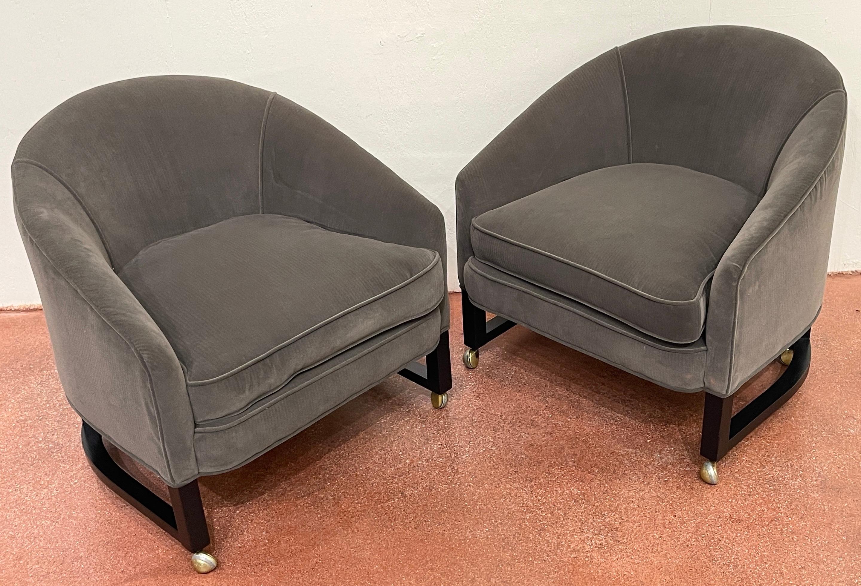 Pair of 1970s Low Profile Barrel Back Club Chairs, Style of Harvey Probber
Each one of sleek proportions, raised on trellis blackened wood frame fitted with castors. Upholstered in neutral gray upholstery.
Overall measurements 27-Inches high x
