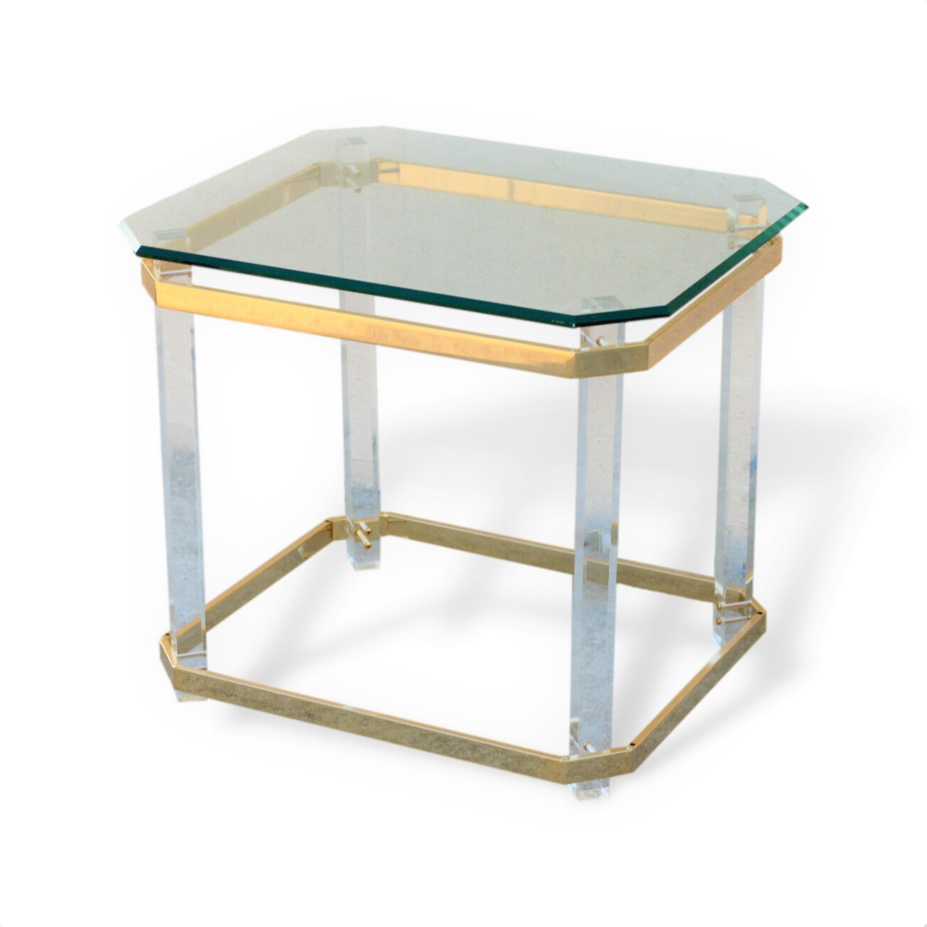 Pair of vintage 1970s lucite brass and glass side tables after Charles Hollis Jones in Hollywood Regency or Mid-Century Modern style.

Lucite has a natural transparency, providing a beautifully clean look, and it doesn’t add any visual clutter.