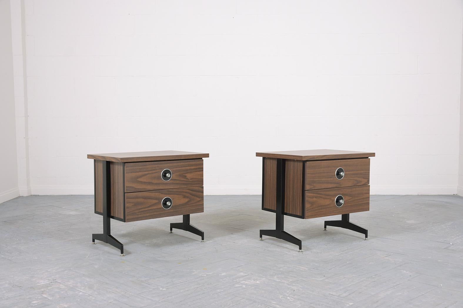 Step back in time with this stunning pair of mid-century modern nightstands from the 1970s, a period renowned for its iconic designs and unparalleled craftsmanship. Perfectly restored to their original glory by our expert in-house team, these