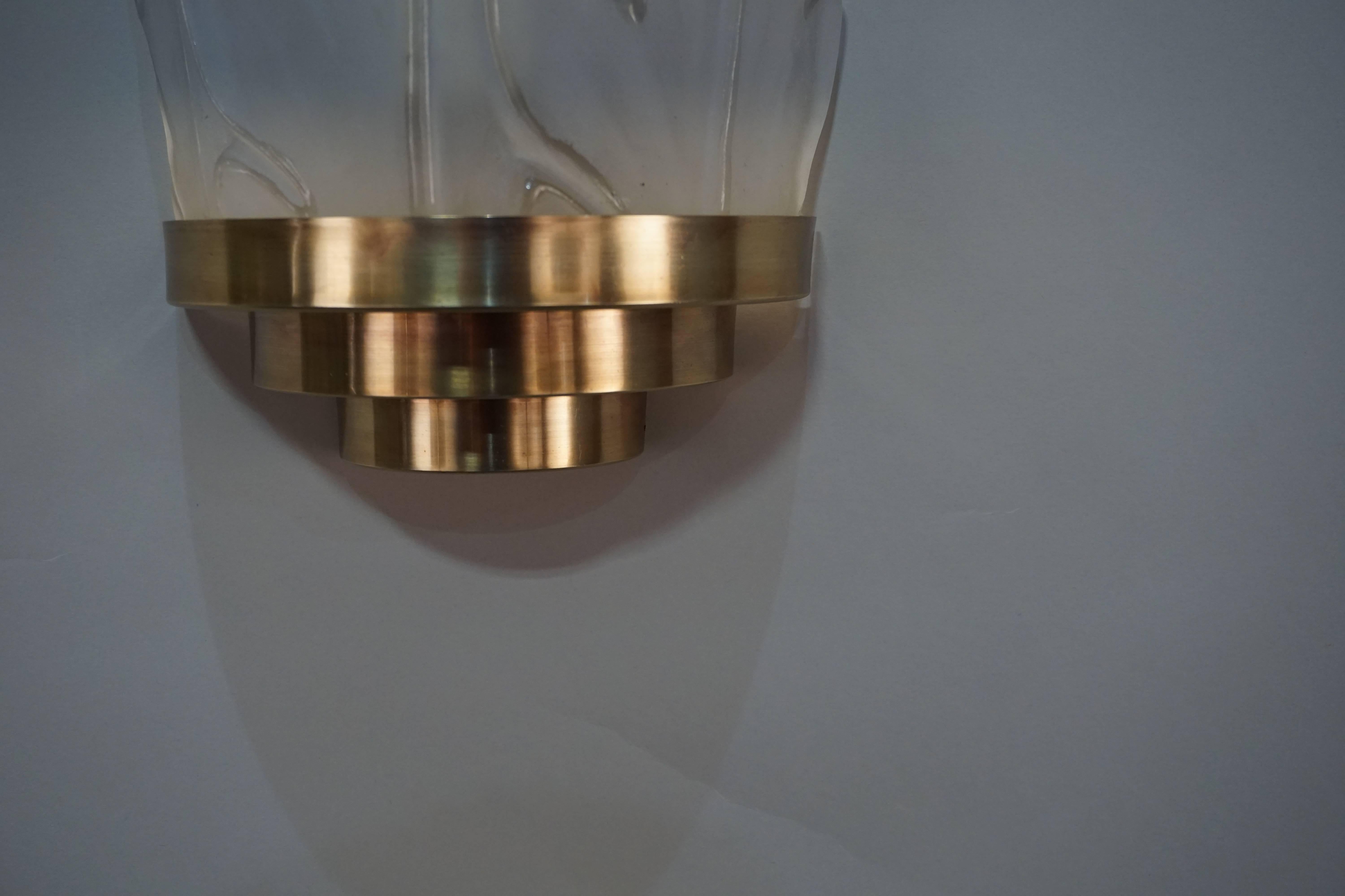 Murano glass leaf design in clear and frost wall sconces with bronze hardware.