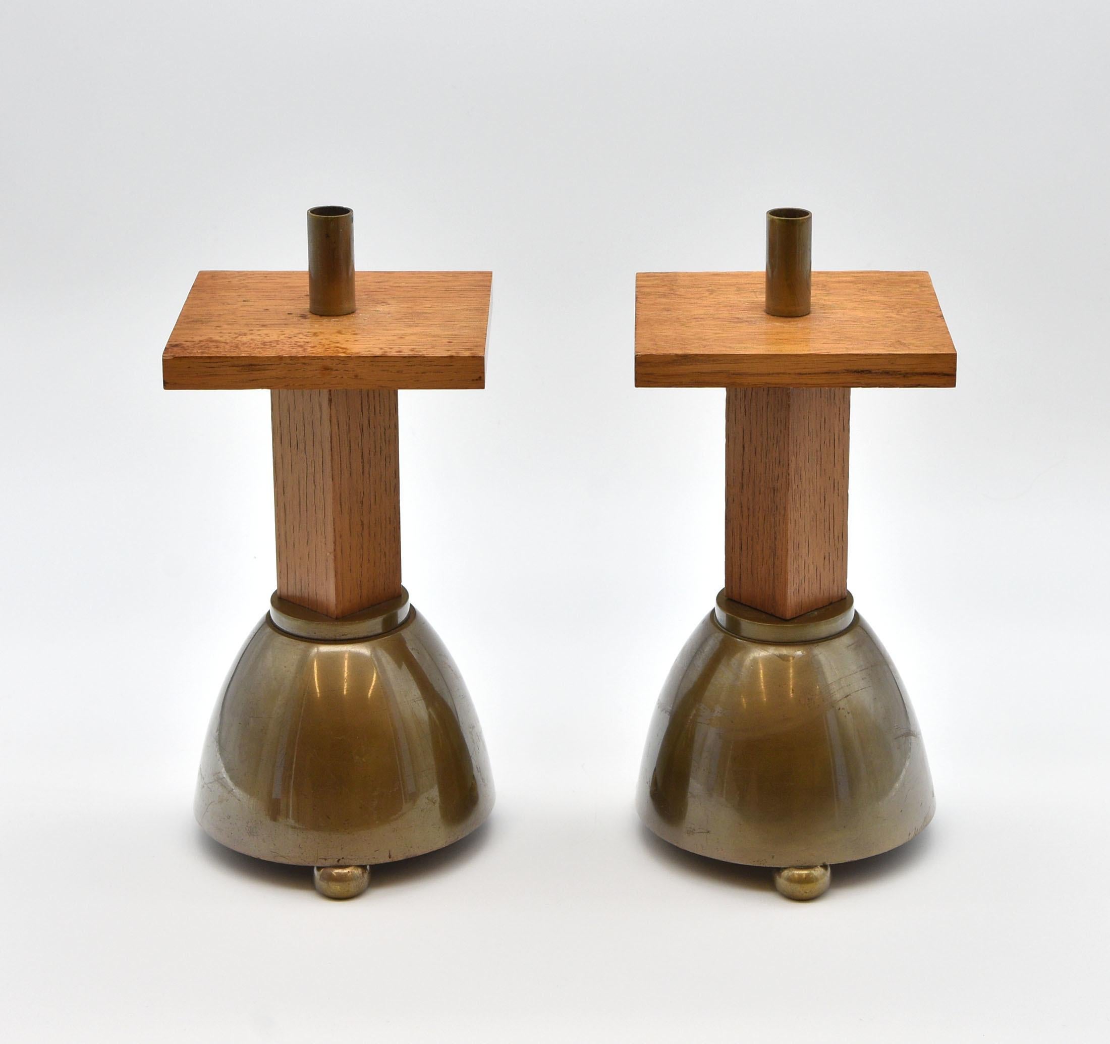 A pair of brass and solid oak candlesticks in a Brutalist manner. Circa 1970.

There are a few signs of use to the finish expected with age and use.