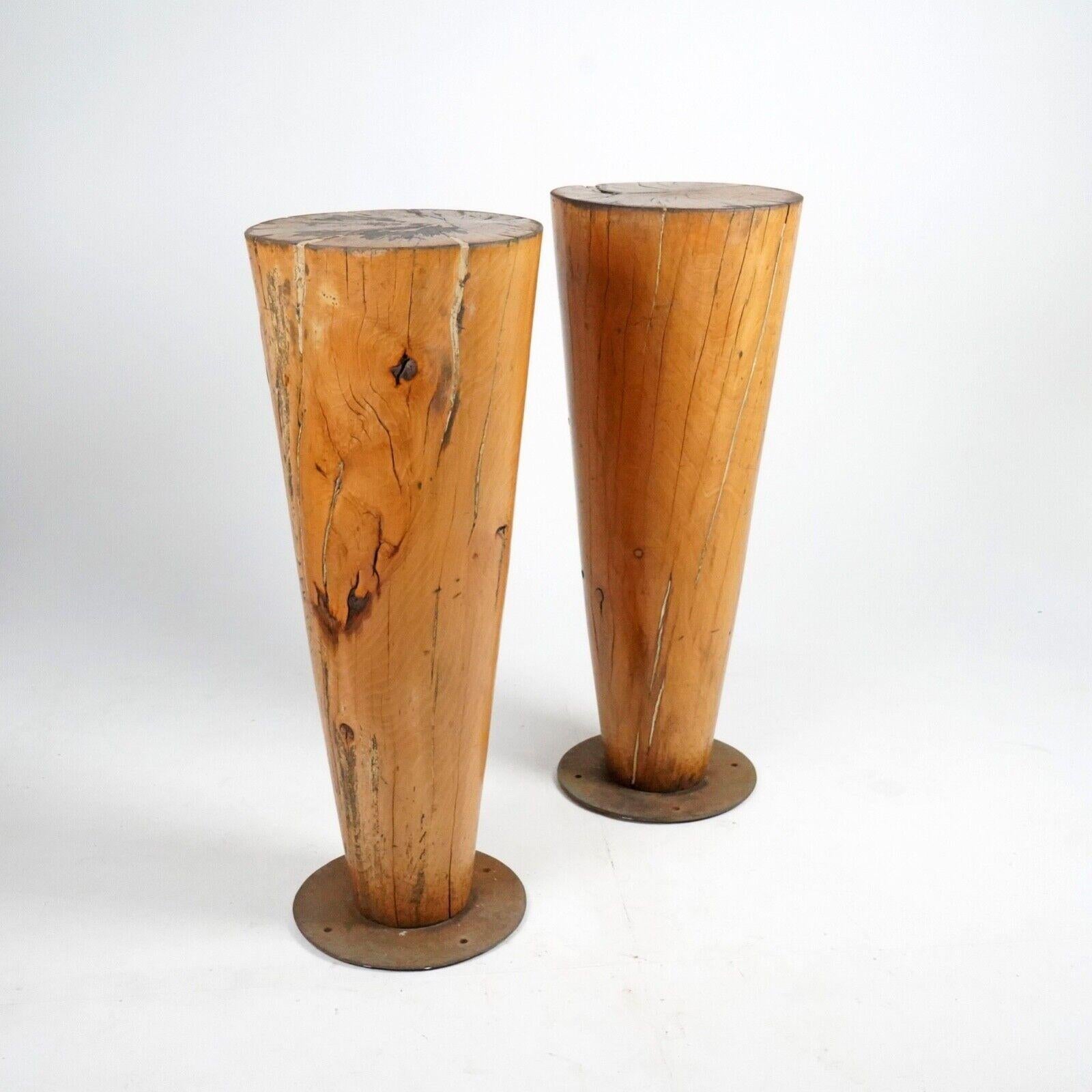A pair of substantial cone shaped tall tables made from solid birch mounted on steel bases. 
Patinated and worn nicely from extensive use. 
They've been gently cleaned and given a wax to bring out the beautiful natural colour of the wood.
Reputed to