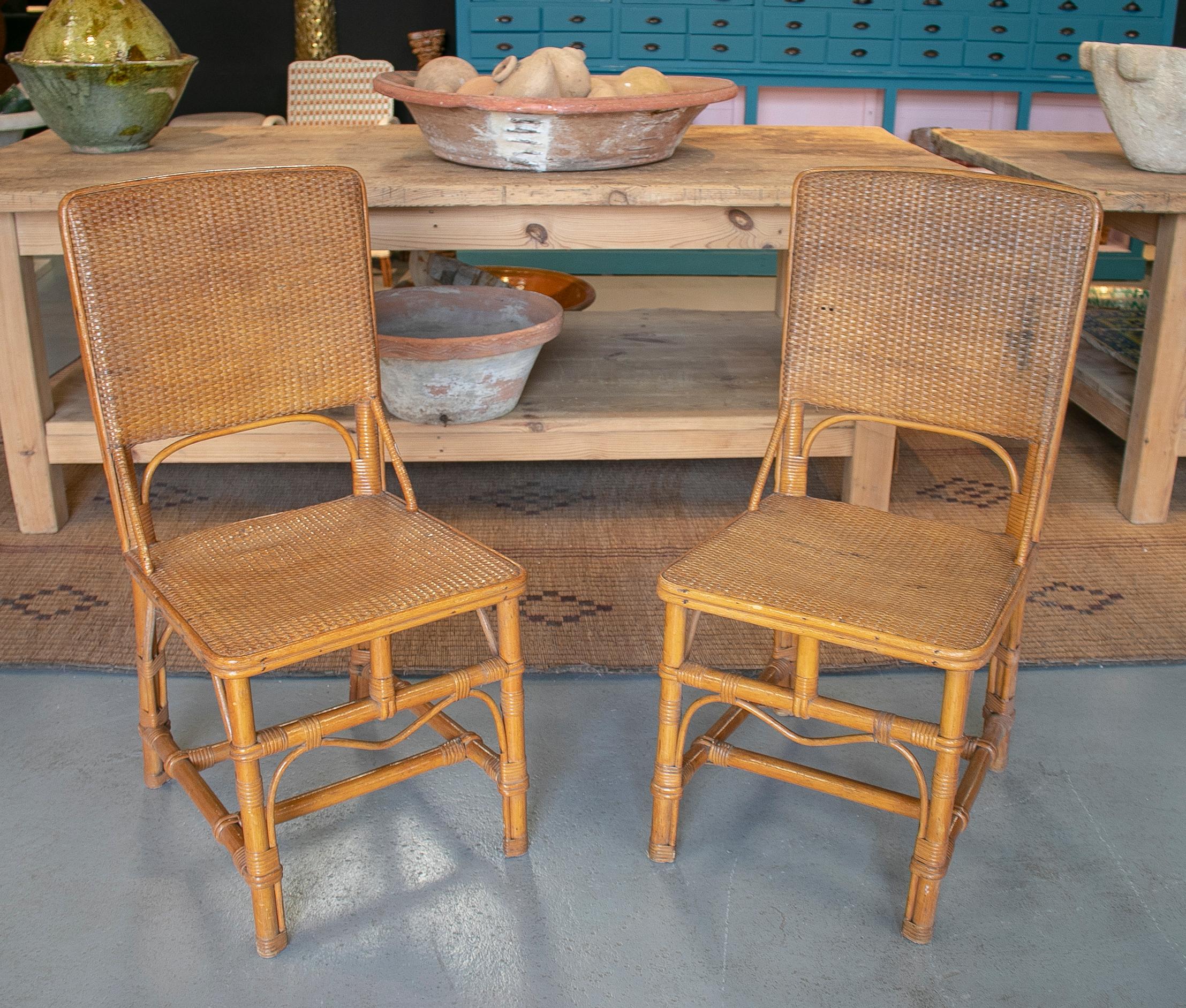 Pair of 1970s Spanish bamboo and hand woven wicker chairs.