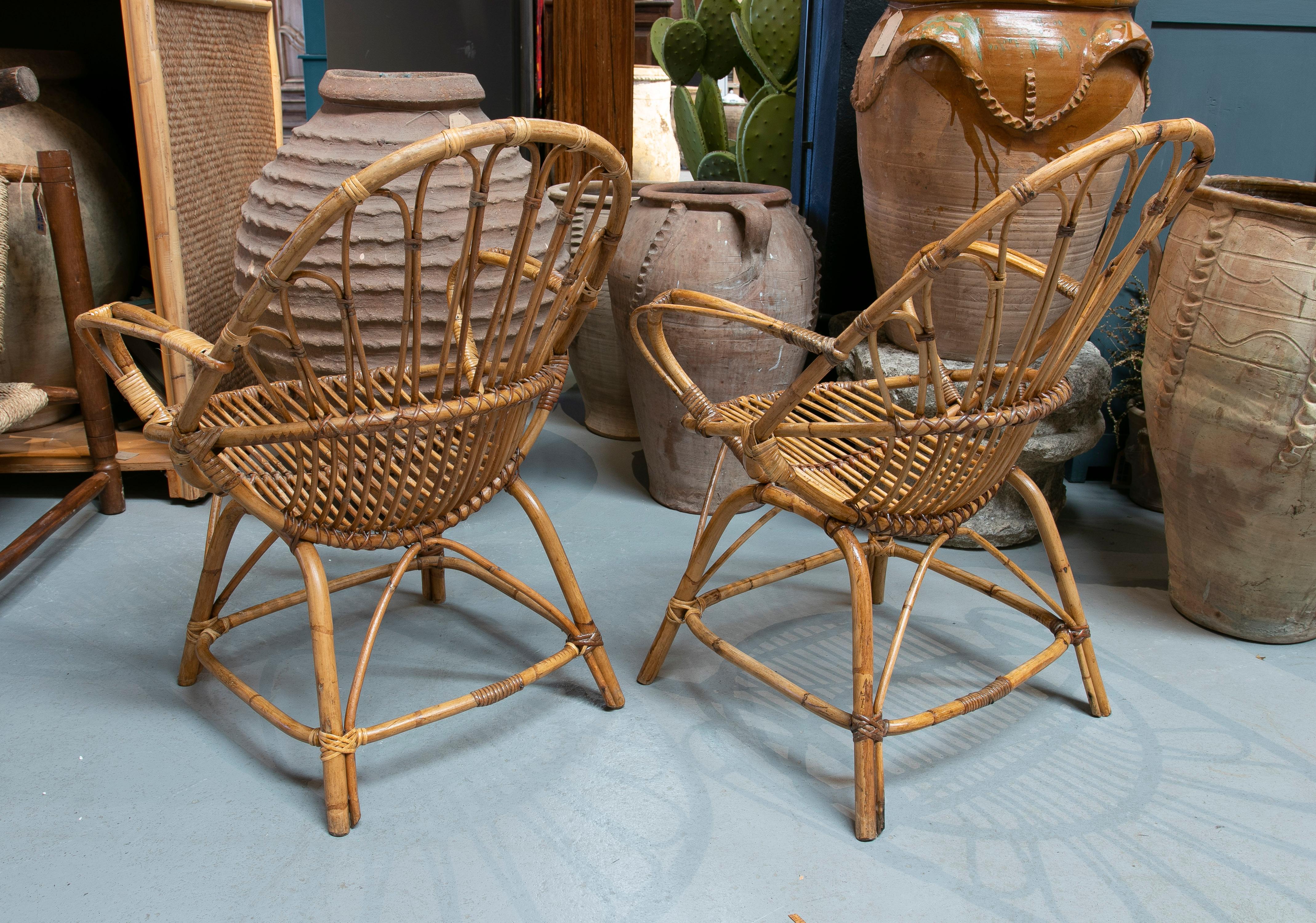 Pair of 1970s Spanish bamboo and woven wicker armchairs.