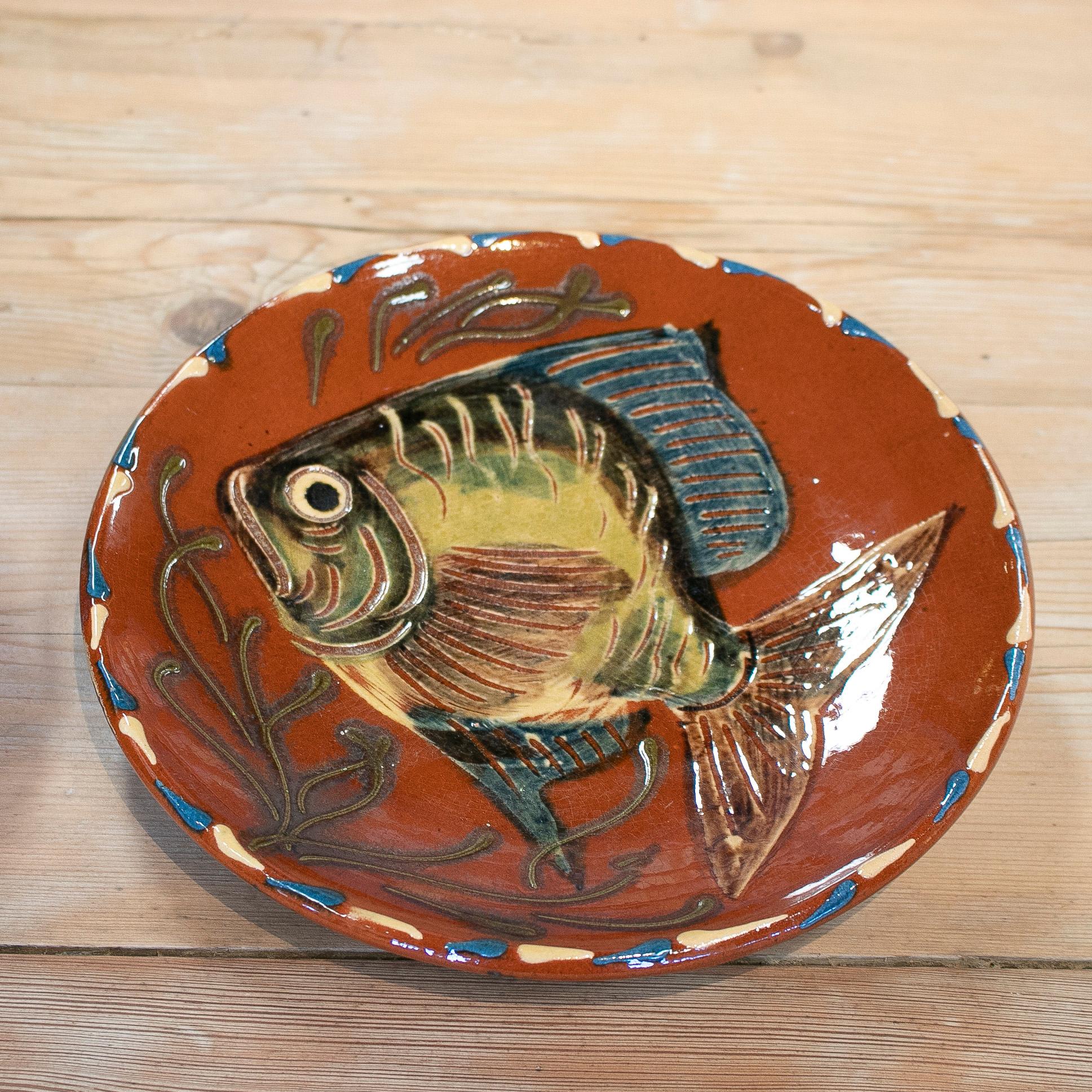 Vintage pair of 1970s Spanish ceramic plates with hand painted fish.