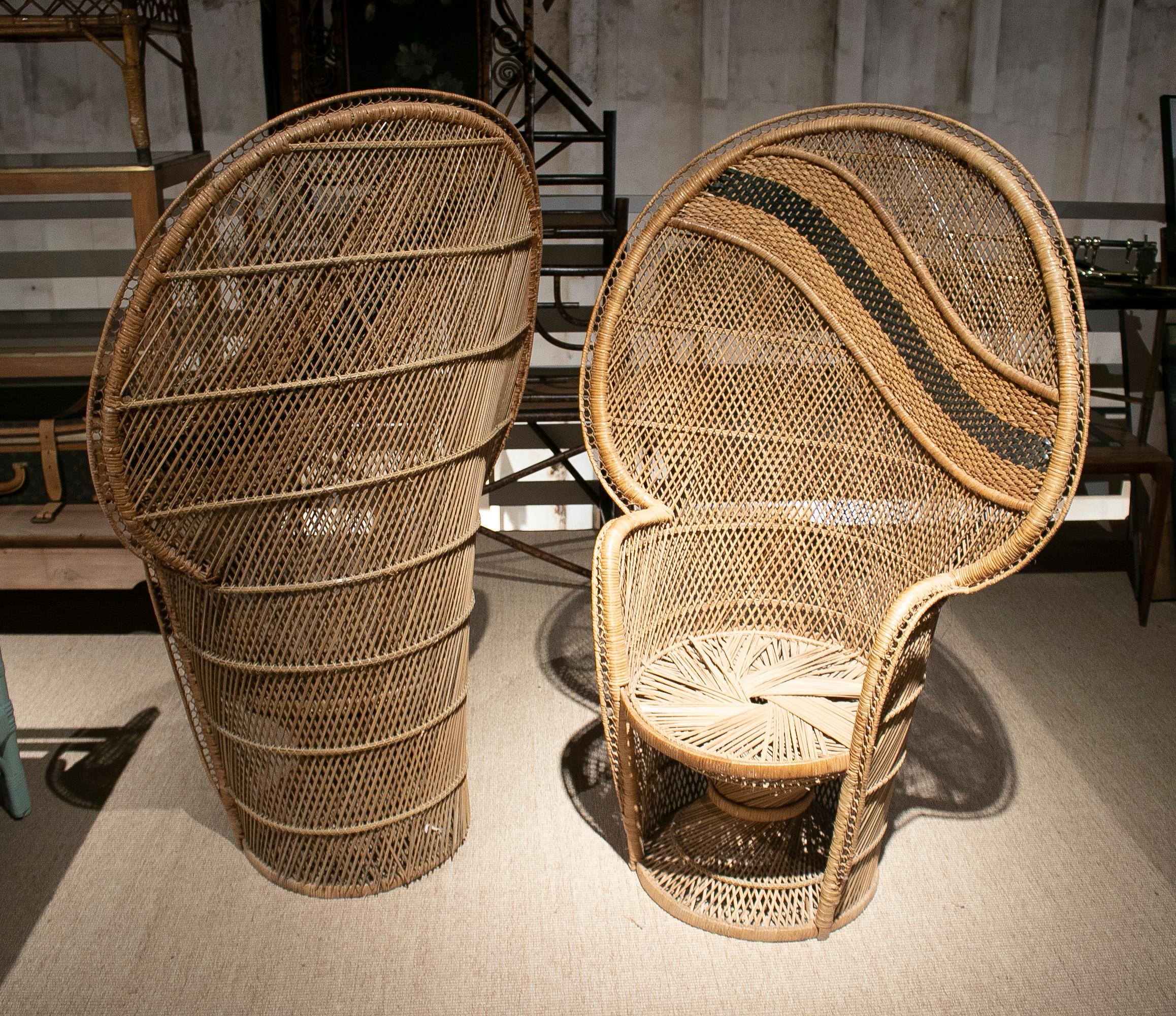 Pair of 1970s Spanish Emannuelle woven wicker tall back armchairs, originally known as peacock chairs.