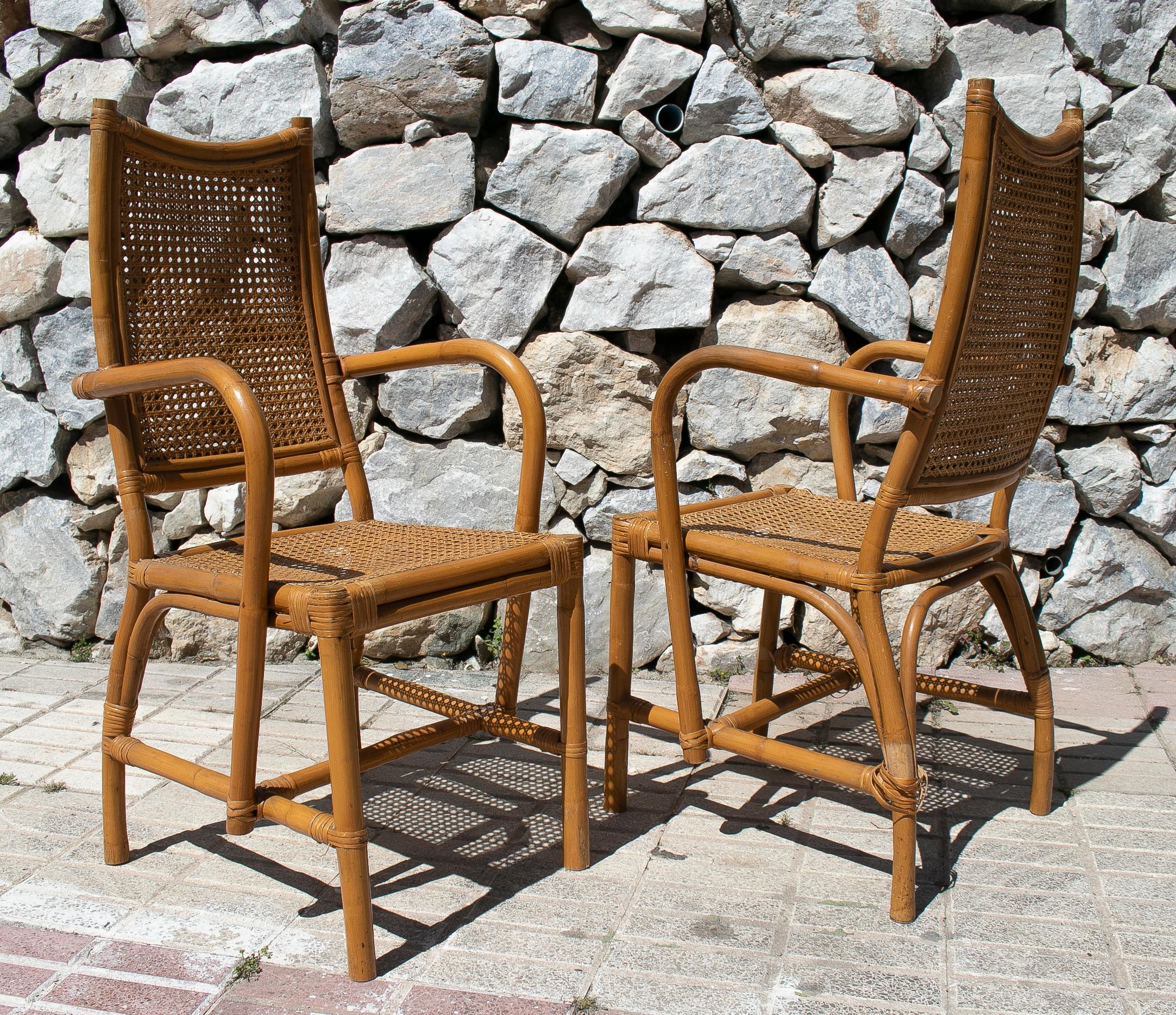 Pair of 1970s Spanish lace wicker and bamboo armchairs.