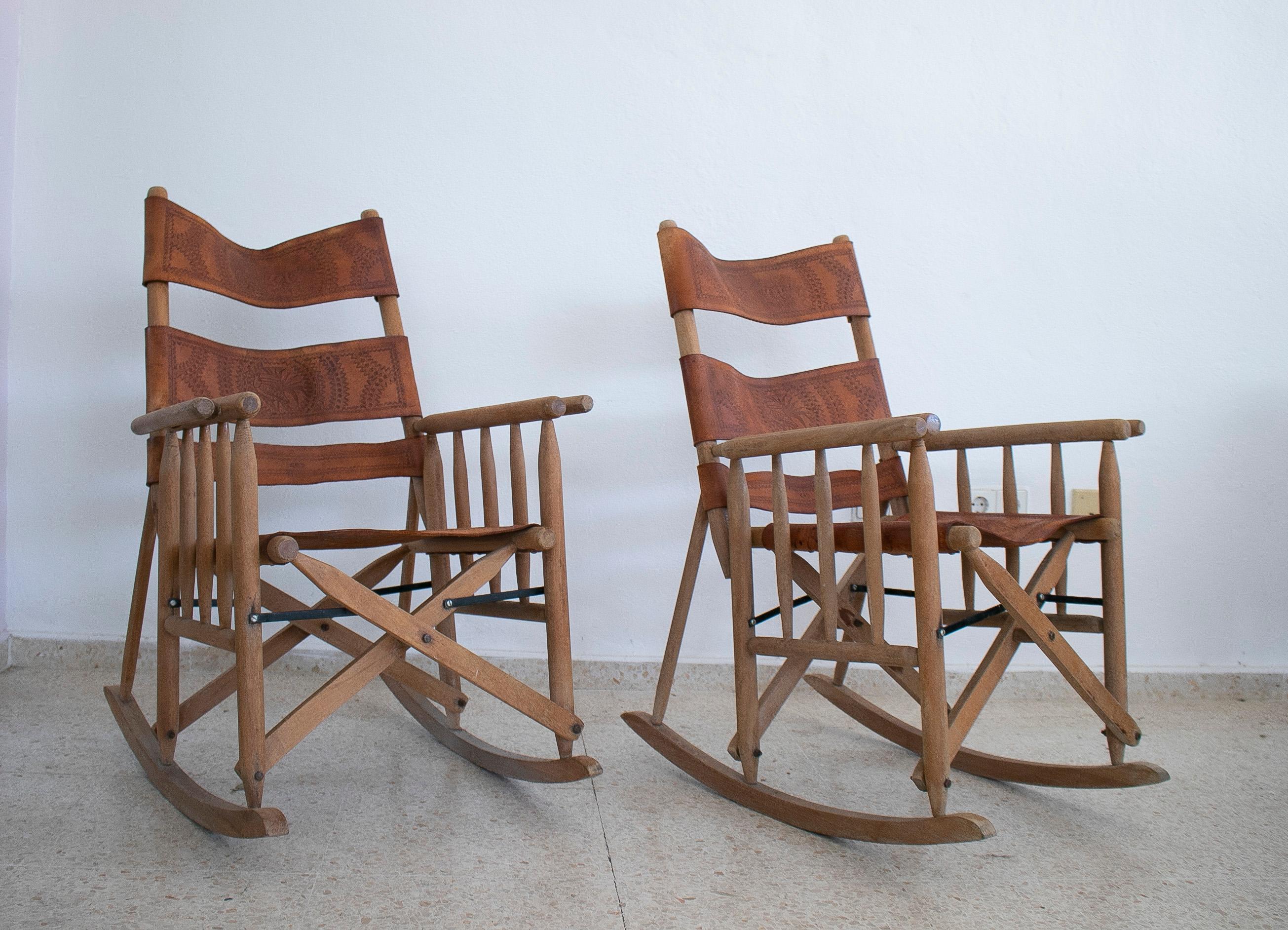 Pair of vintage 1970s Spanish leather wooden rocking chairs.