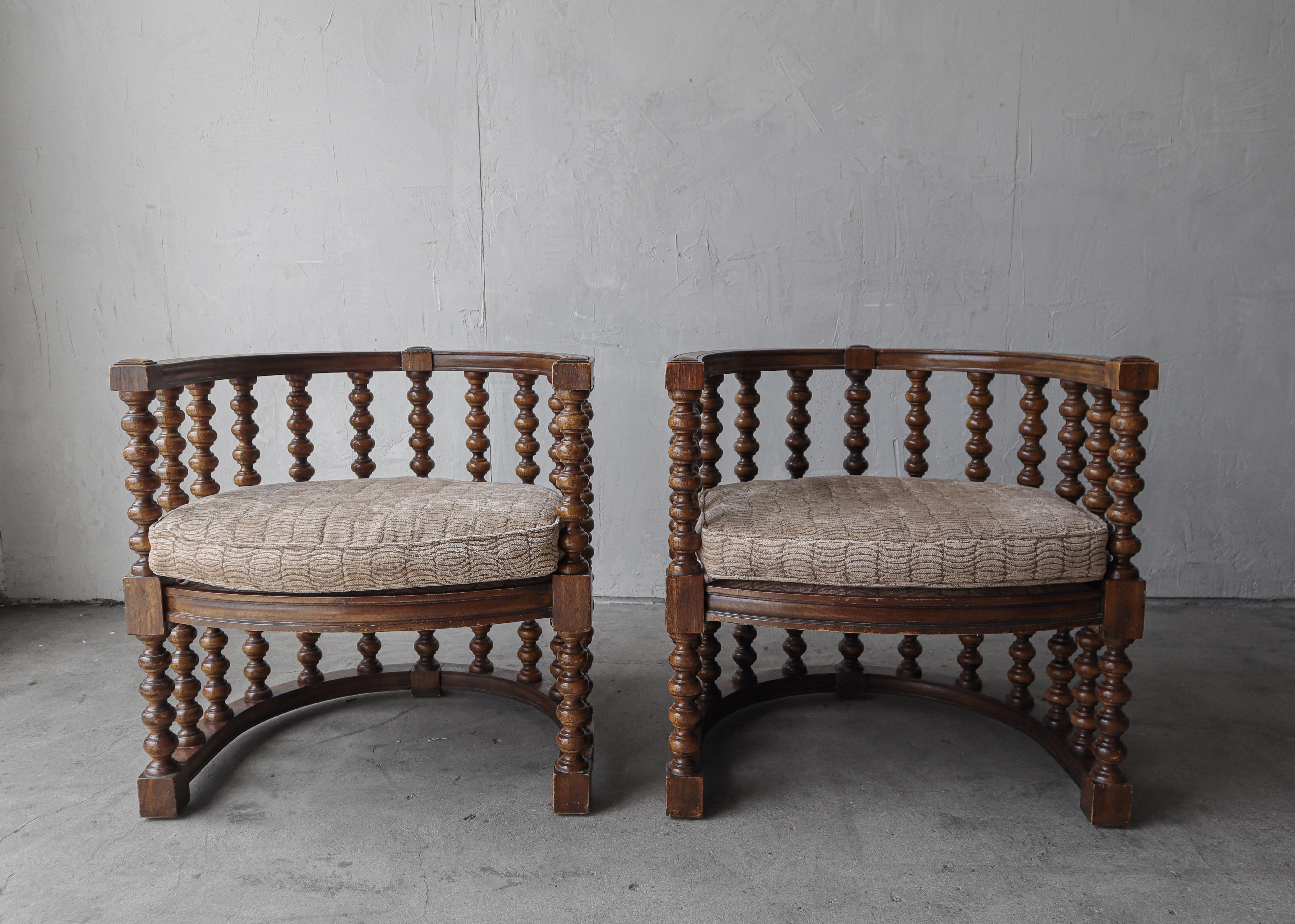 I just love this pair of hand carved Spanish Revival style bobbin barrel chairs.

The bold spindle frame makes these chairs real statement pieces.

Chairs are in as found condition.  There is some signs of age and use, no damage, mainly just finish