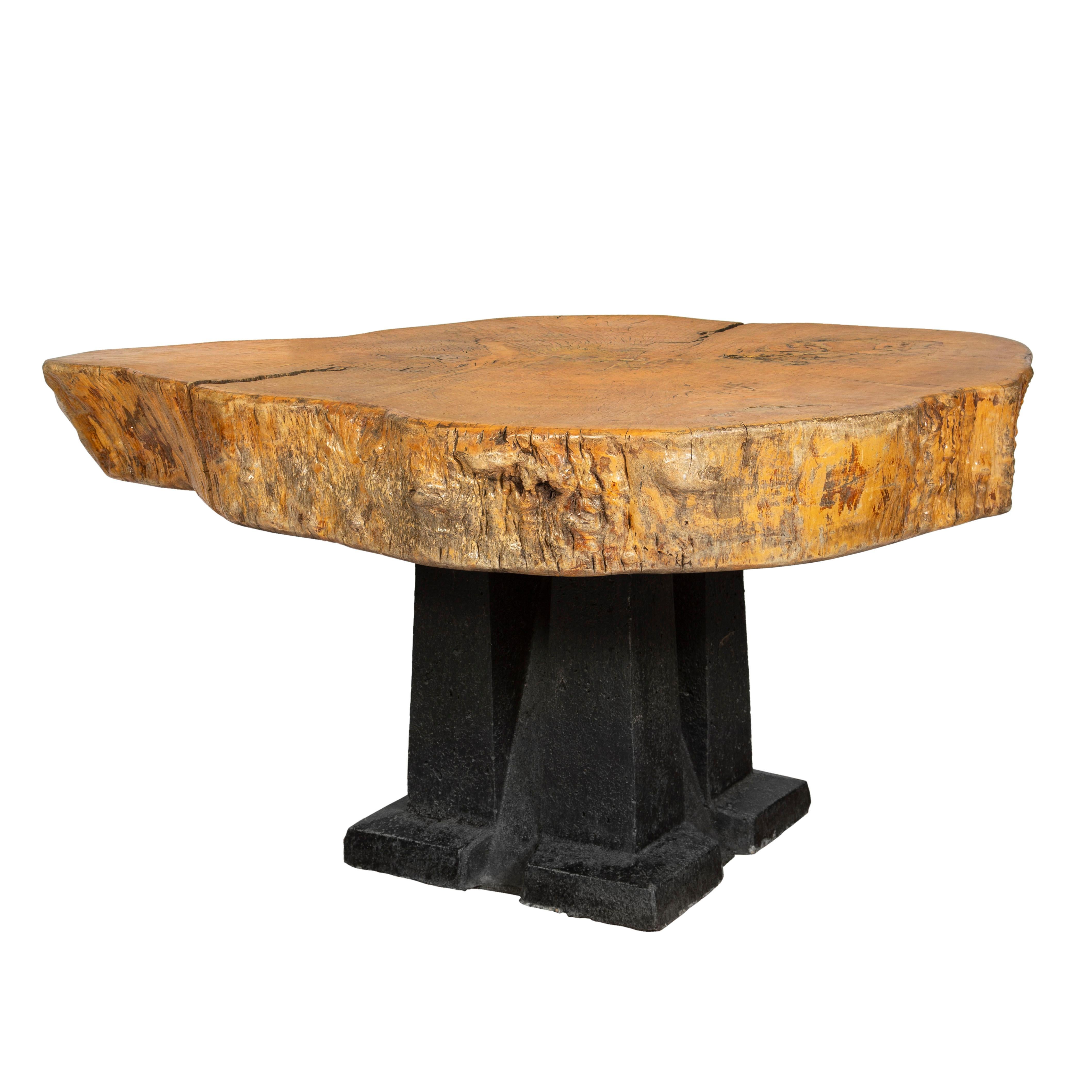 A pair of impressive thick oak slab tables with solid iron bases. Both were originally created in early 1970s for an architectural firm in Paris, France. The overall scale of the materials used makes them substantial and grand pieces of design and