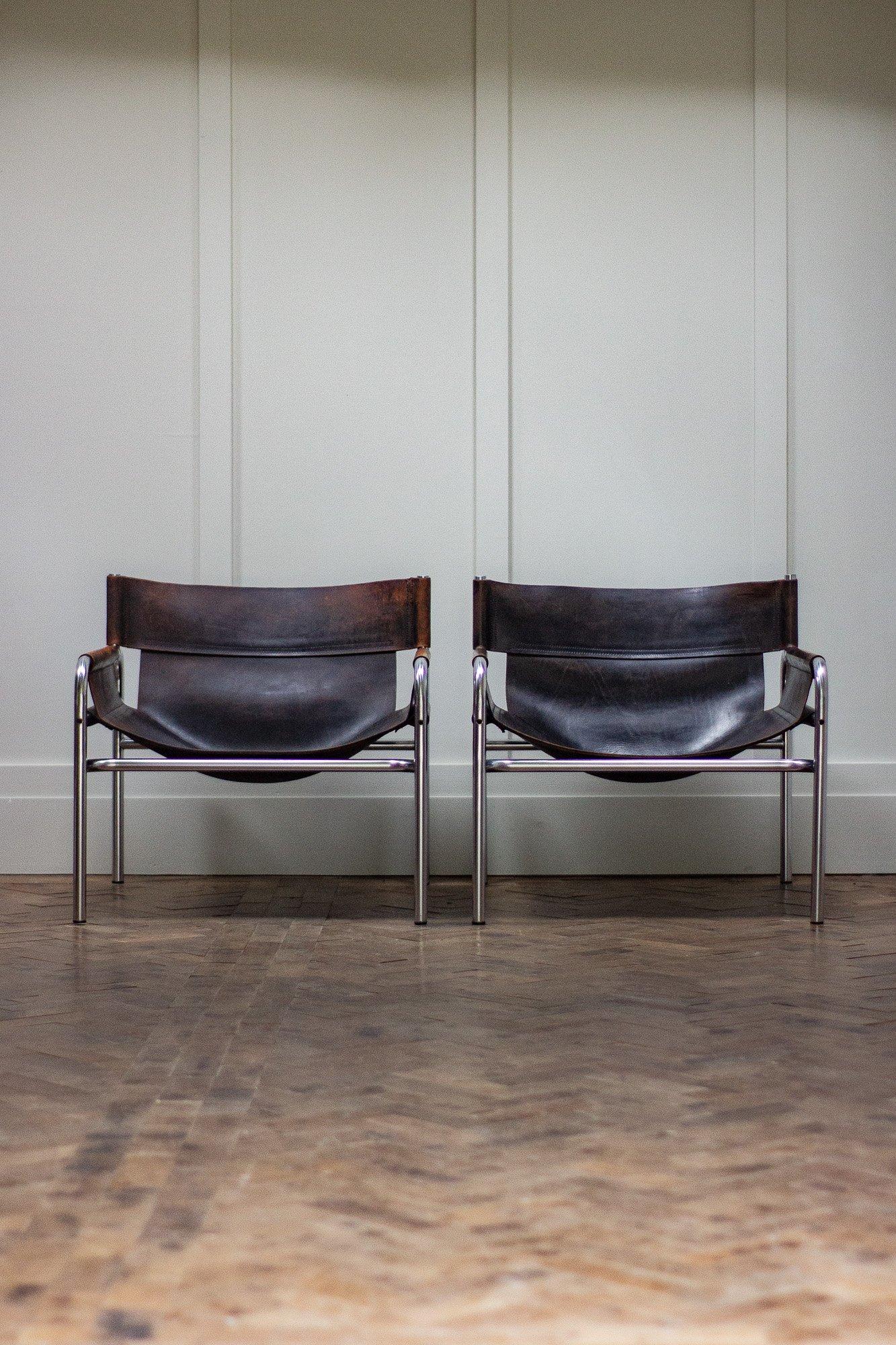 Pair tubular chrome and leather chairs designed by Walter Antonis for Dutch company t'Spectrum in the 1970s.

Price is for the pair.

Measures: Height 66cm

Seat height 30cm

Width 68cm

Depth 75cm.