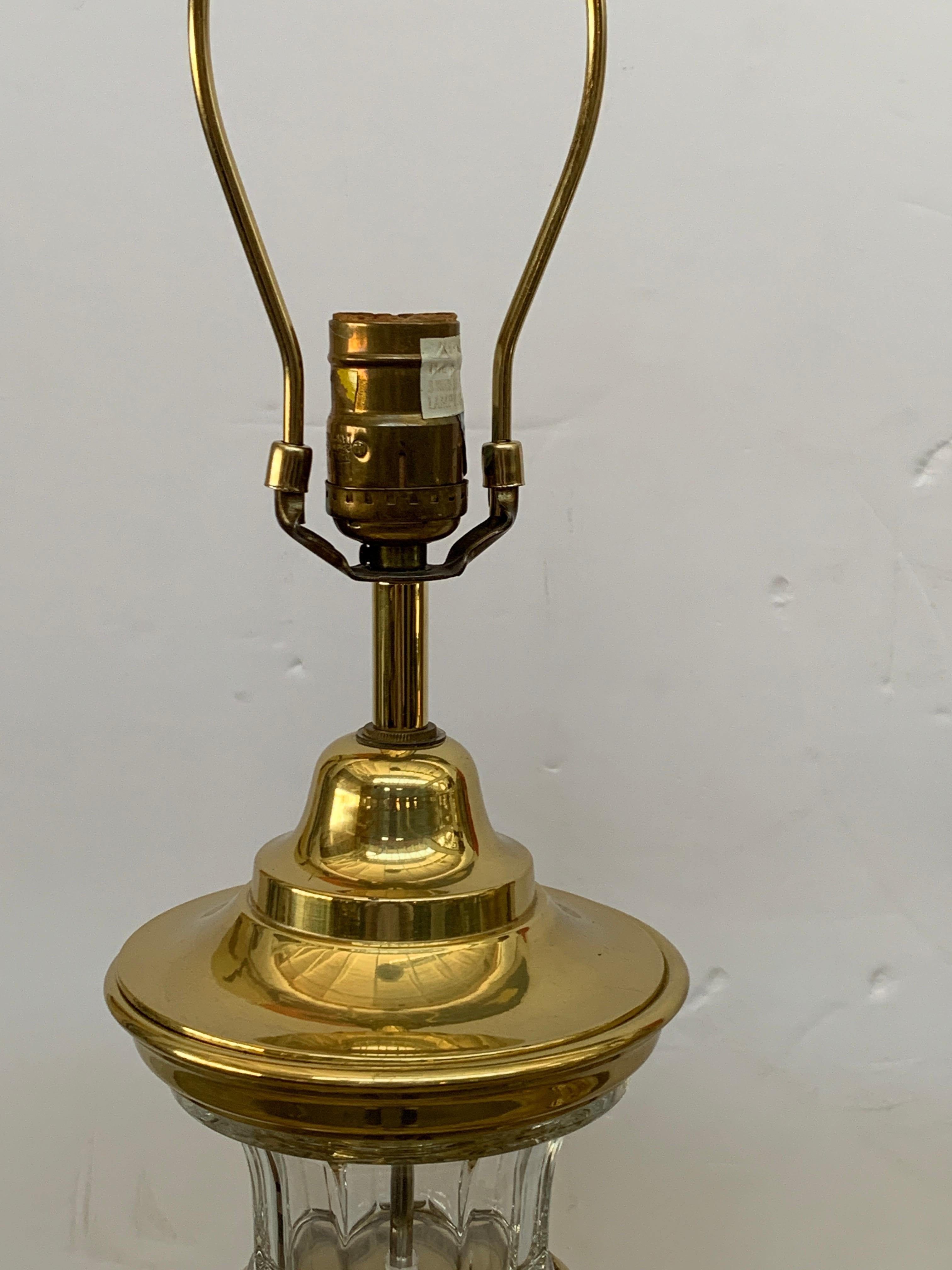 A nice pair of vintage 1972 labelled Chapman lamps in glass and brass. These works are functioning and quite pretty. There are no shades. One lamp has the original felt bottom. The other has felt pads. In good age appropriate condition with minor